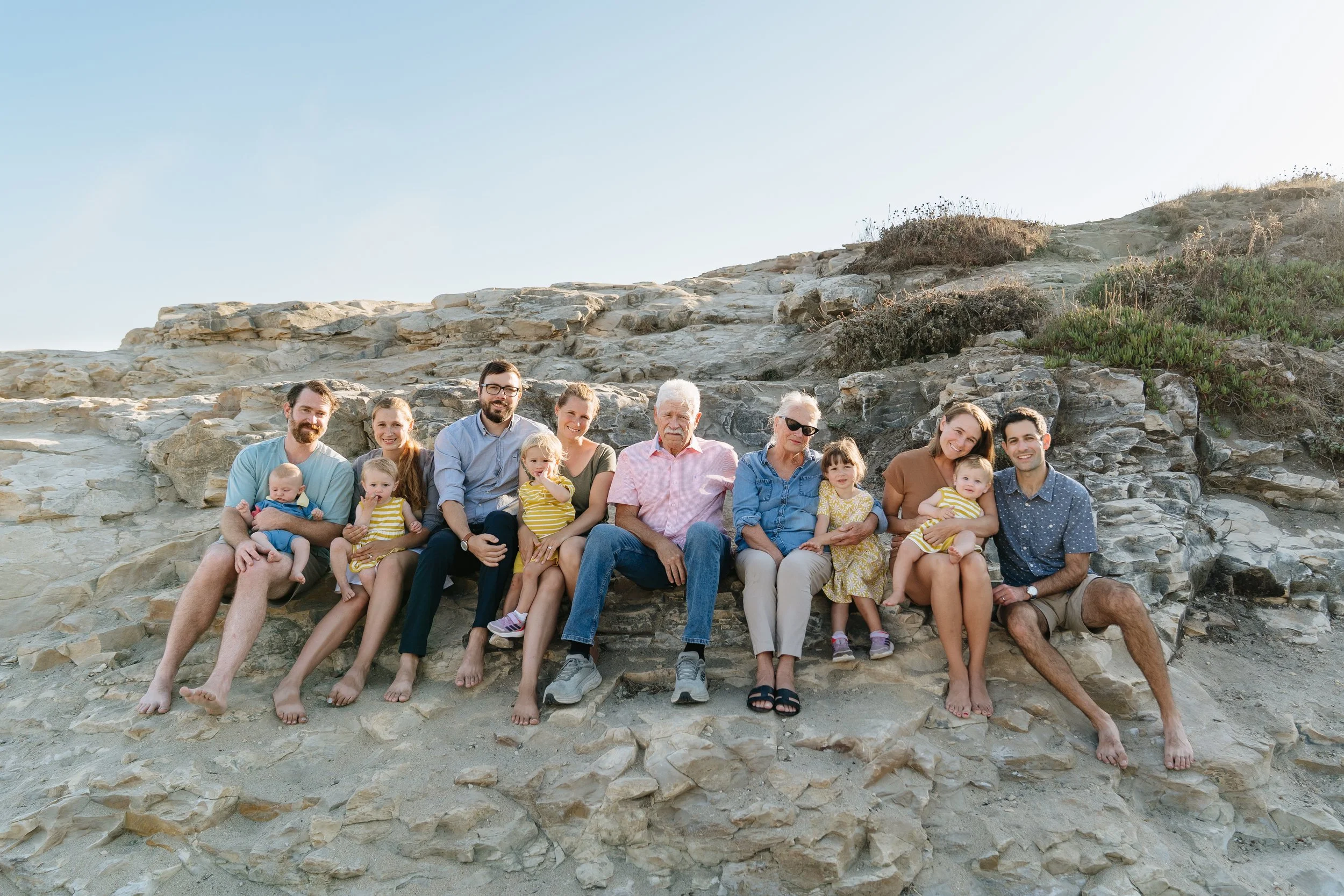 Parents and children laughing during Santa Cruz family session