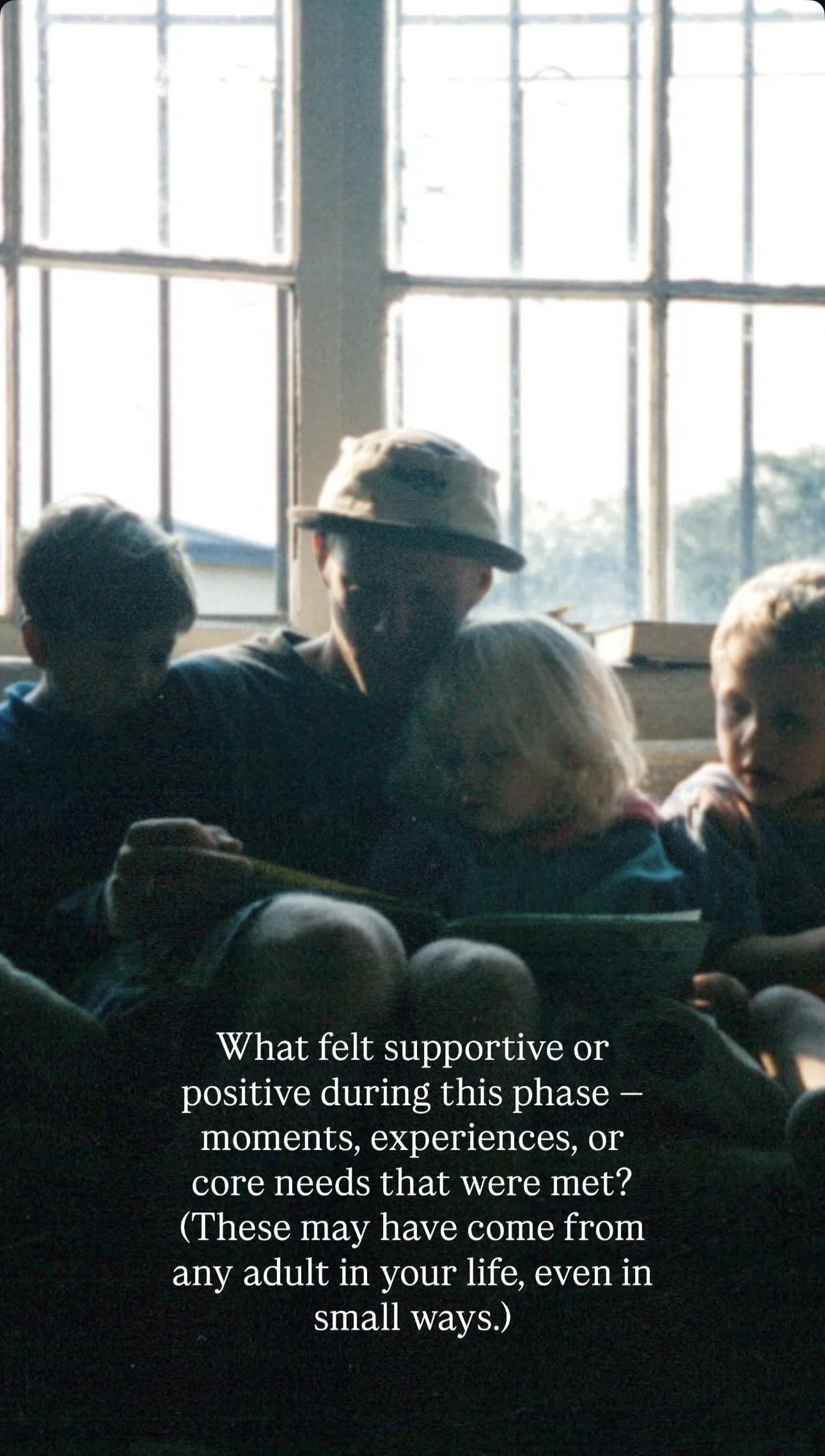 People sitting together indoors near a large window, engaged in a conversation or activity, with a quote about support and positive experiences during challenging times overlaid on the image.