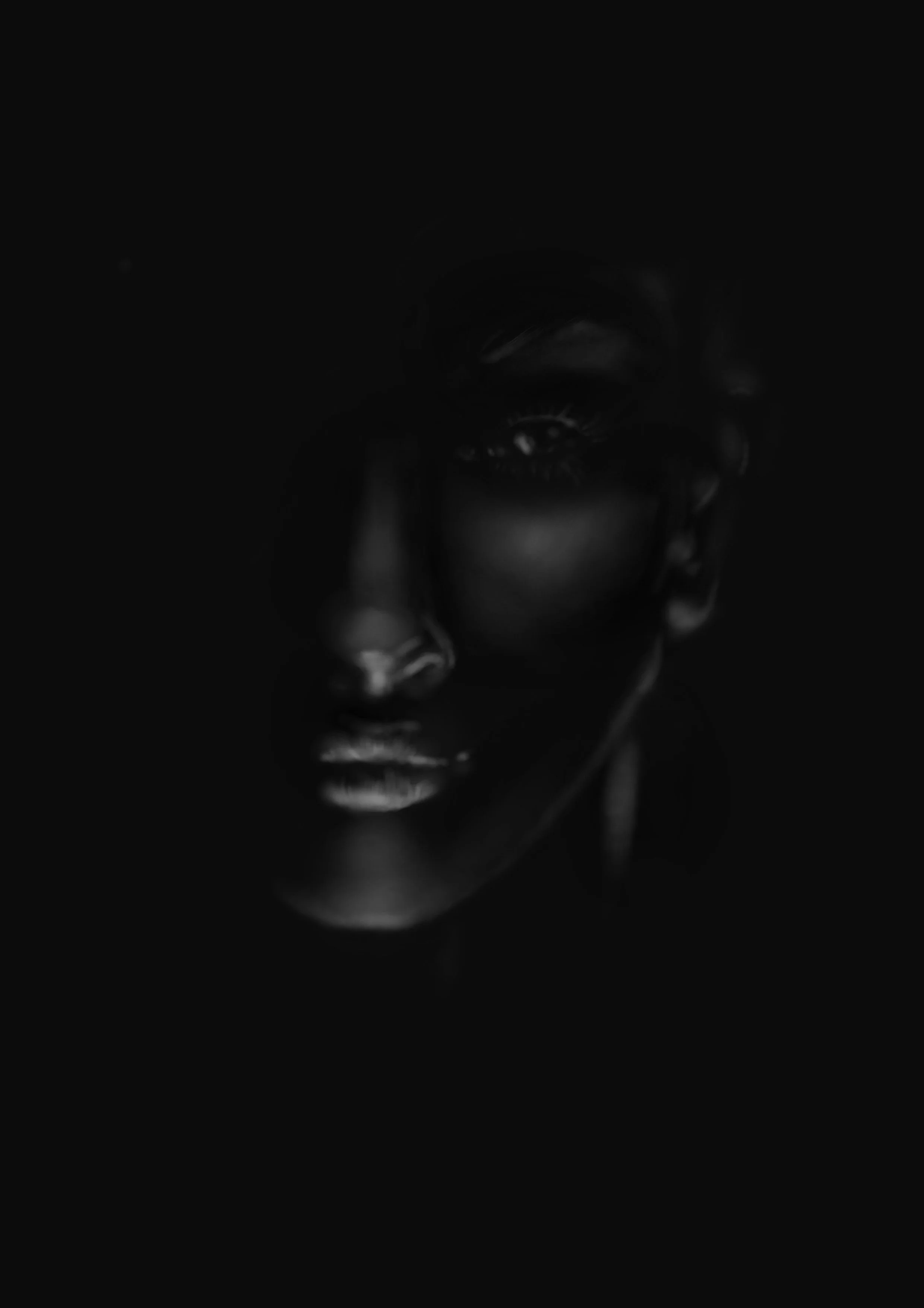 A face is revealed from the shadows. She's been watching and waiting patiently.