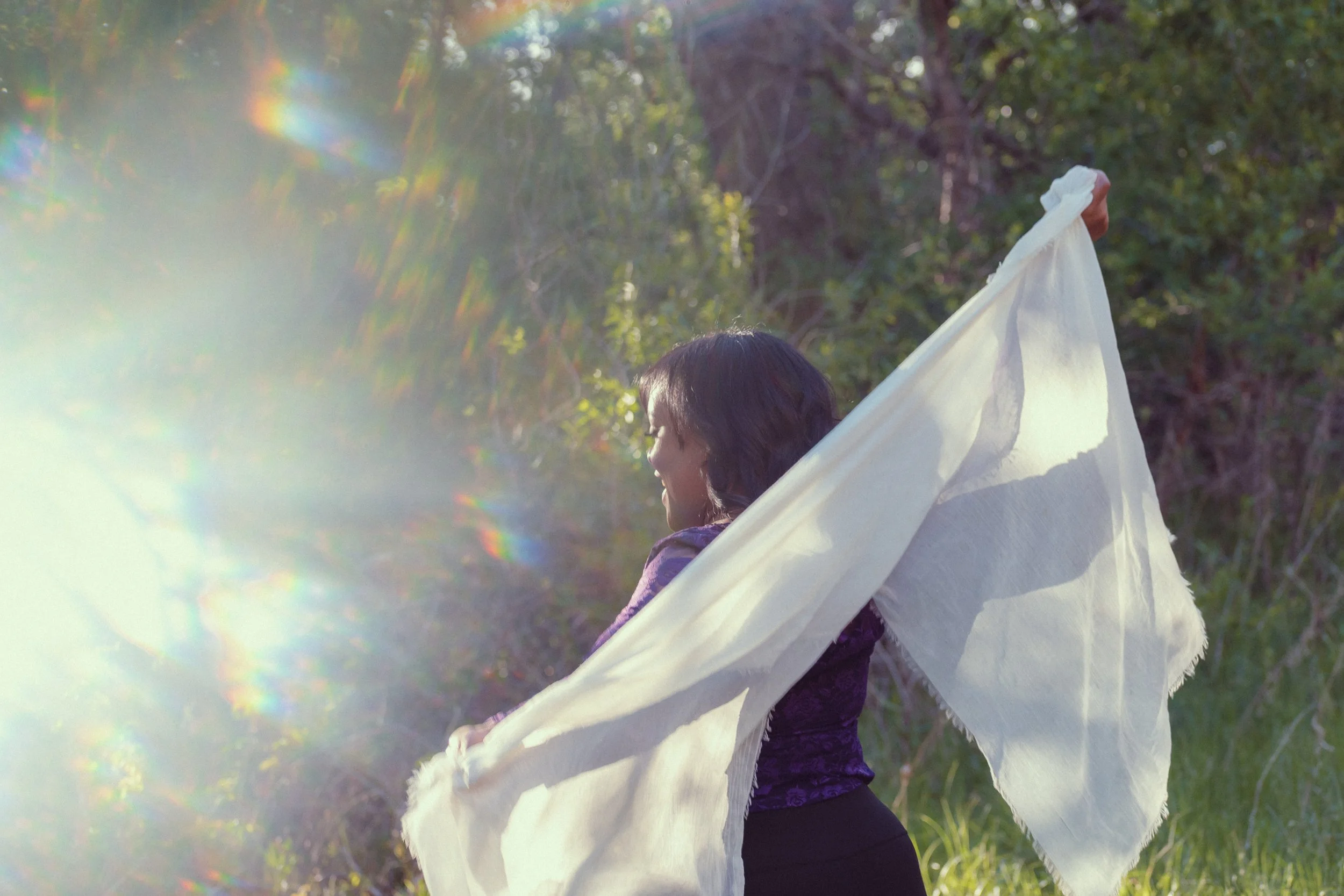 woman playing with cloth in nature 