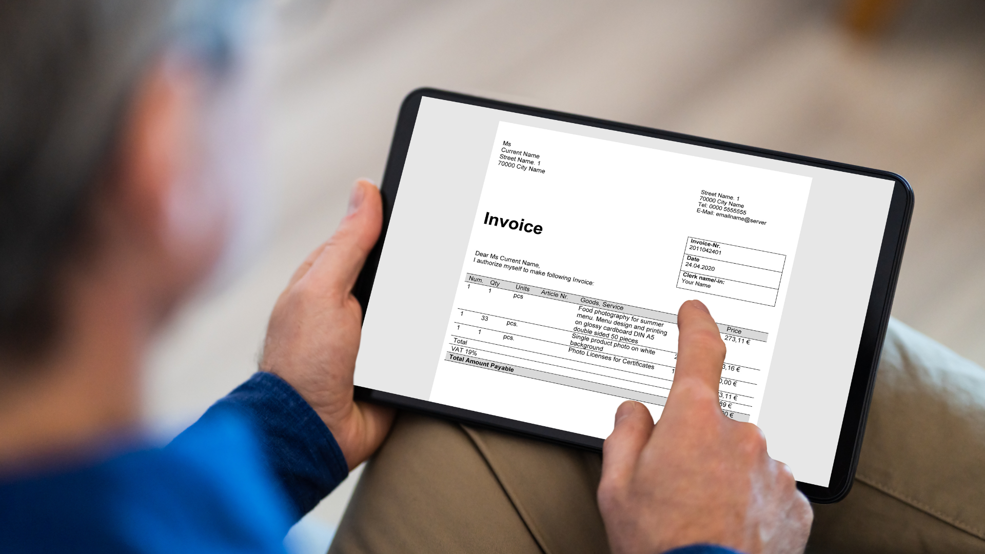 A business owner creating an invoice using digital accounting software