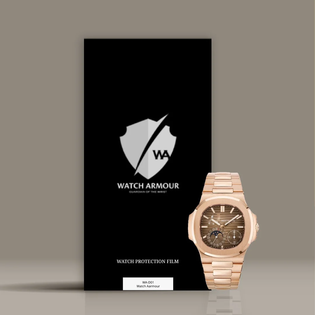 A rose gold Patek Philippe wristwatch with a brown dial displaying multiple subdials and date, placed next to a black Watch Armour protective film package on a reflective gray surface.