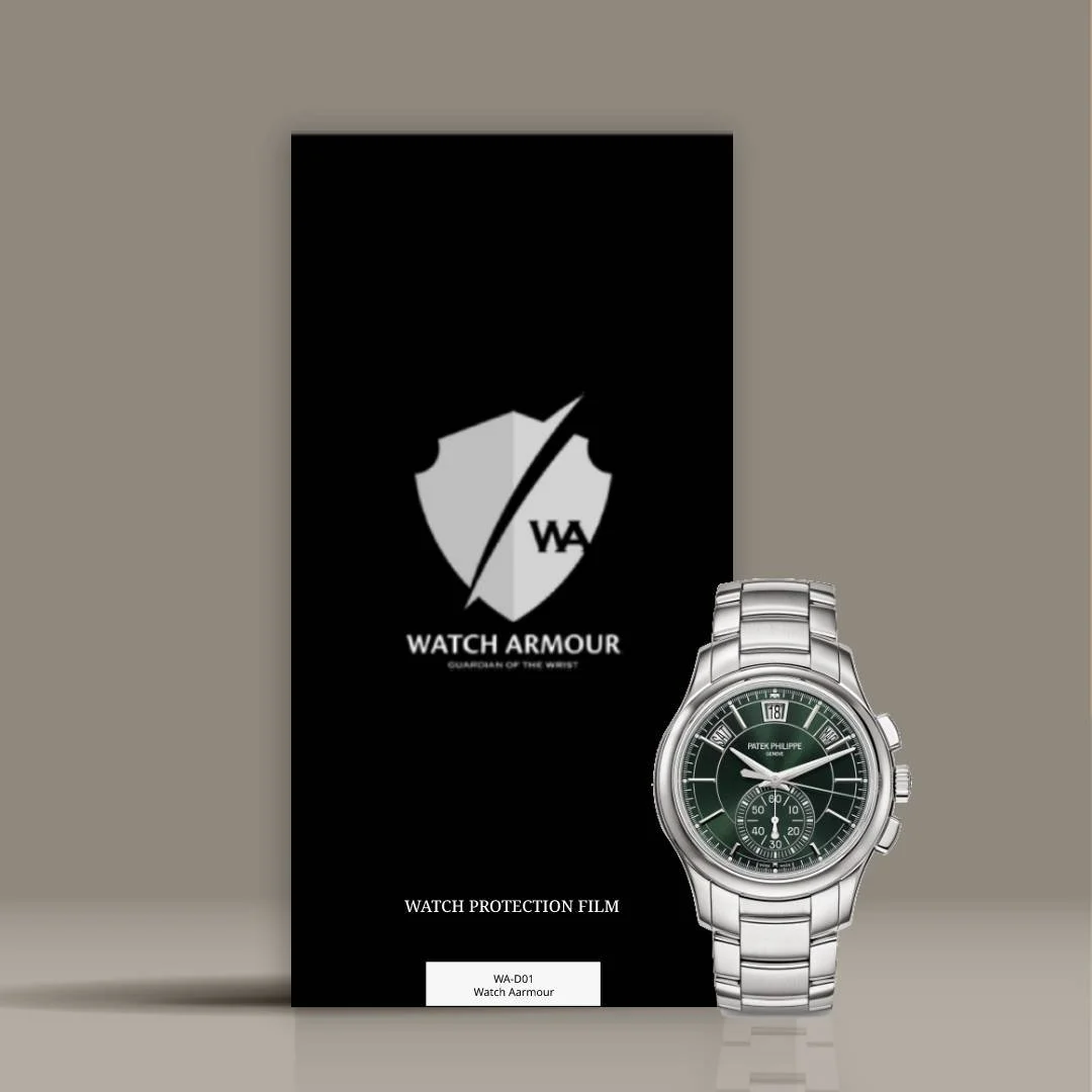 A black Watch Armour protection film package featuring a shield logo with a diagonal slash, and a luxury Patek Philippe wristwatch with a green dial and silver metal band positioned in front of the package.