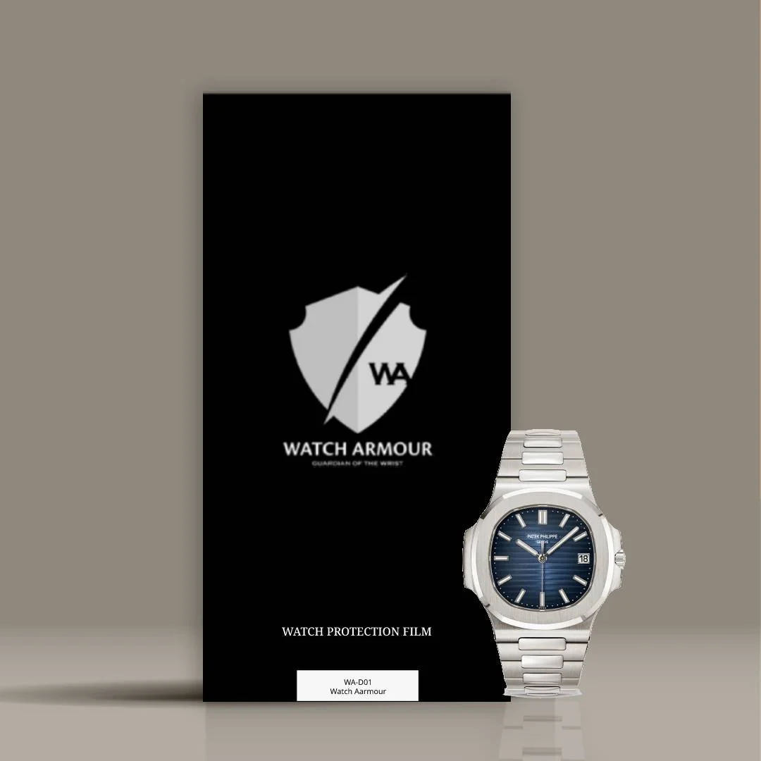 A silver Patek Philippe watch with a dark blue dial next to black Watch Armour watch protection film packaging.