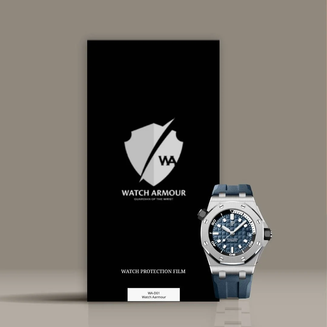 A watch protection film package from Watch Armour with a silver and black wristwatch placed in front of it.