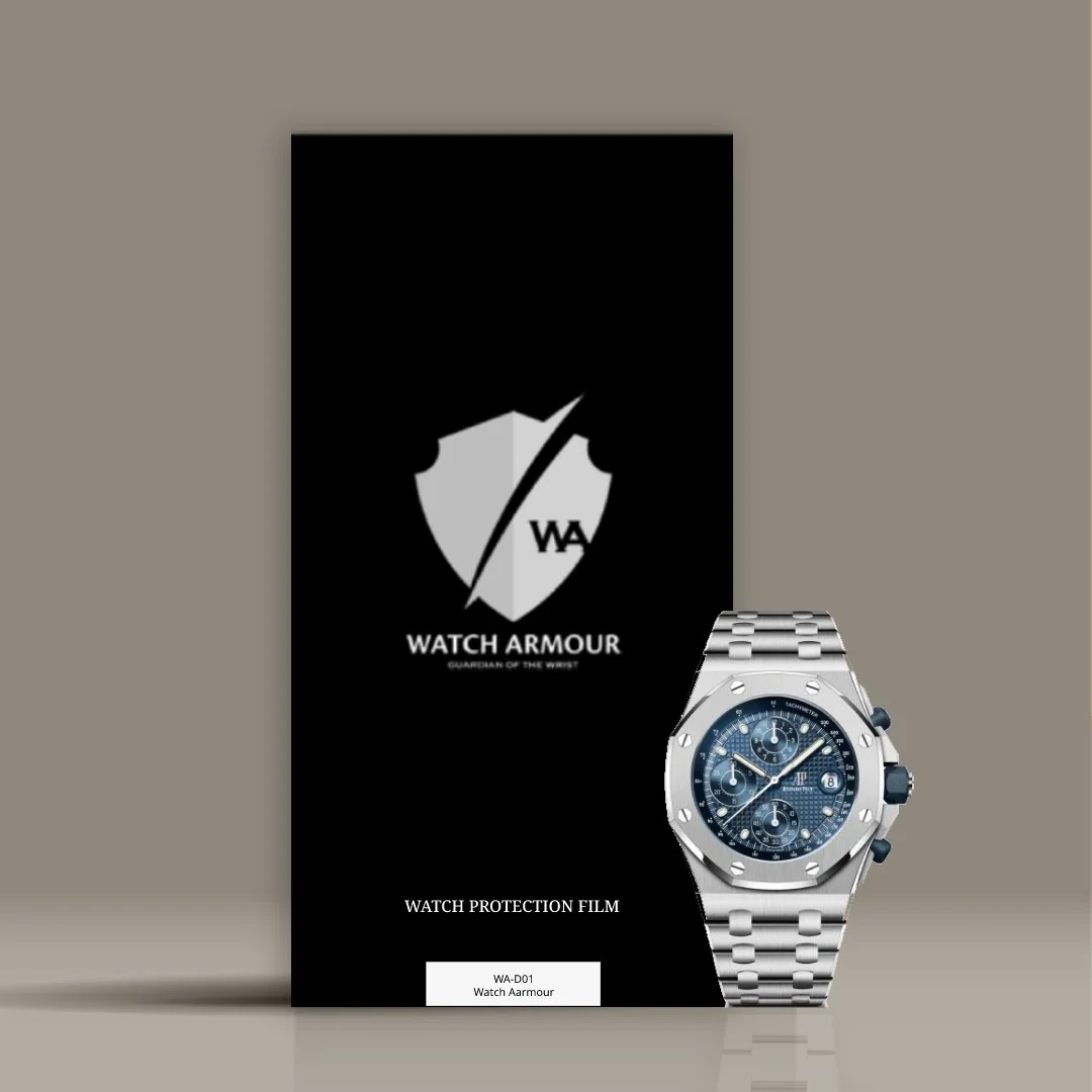 A black Watch Armour watch protection film package standing upright with a silver watch displayed in front of it. The package has a shield logo, the words "WATCH ARMOUR" and "GUARDIAN OF THE WRIST," and indicates it is a watch protection film.