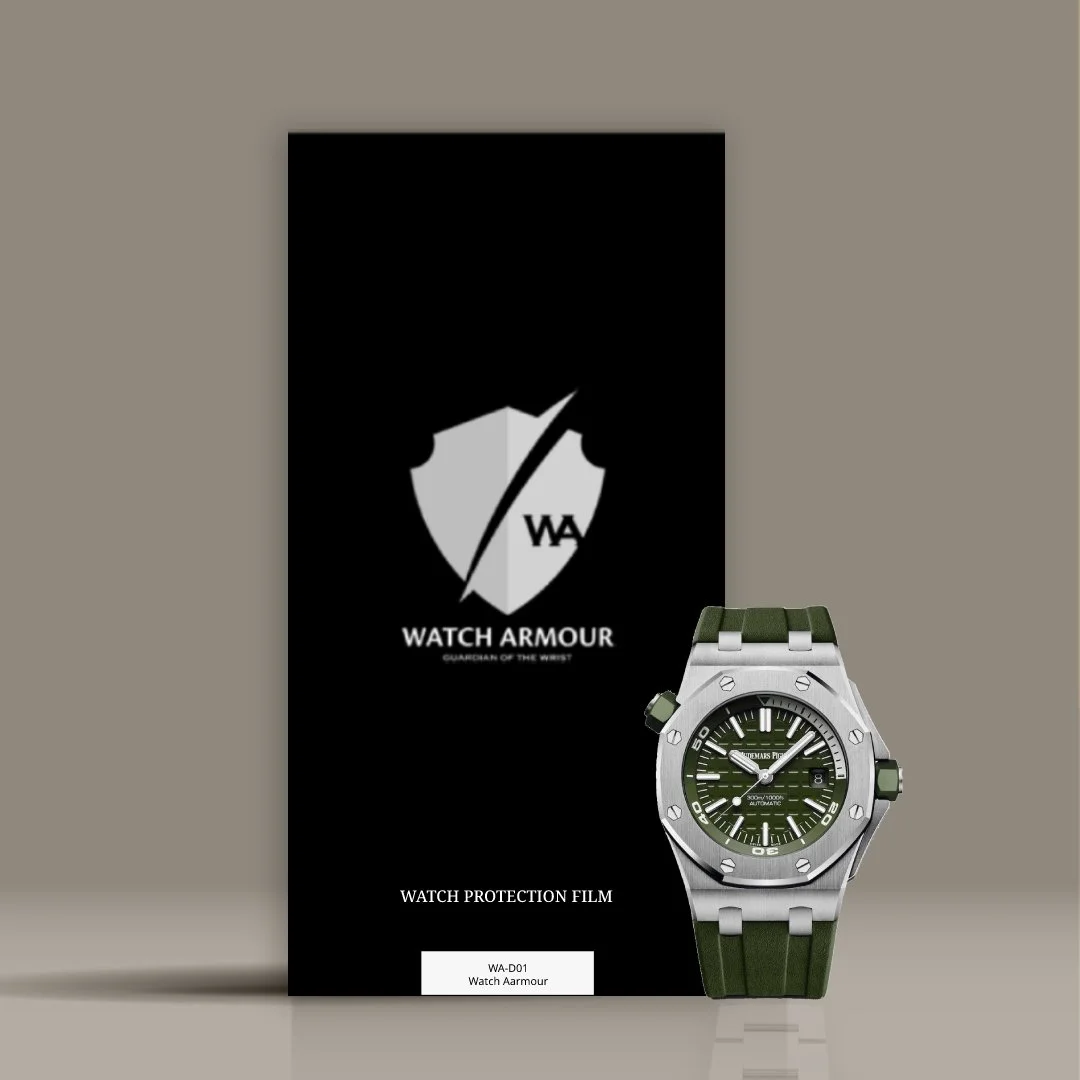 Watch Armor protection film with a green dial watch placed on the film package, which features a black background with a silver shield logo and the text 'WATCH ARMOUR' and 'GUARDIAN OF THE WRIST'.