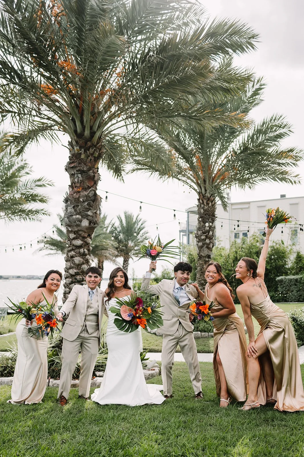 A bride with her diverse wedding party at Waters Edge Venue in El Lago, just south of Houston, TX