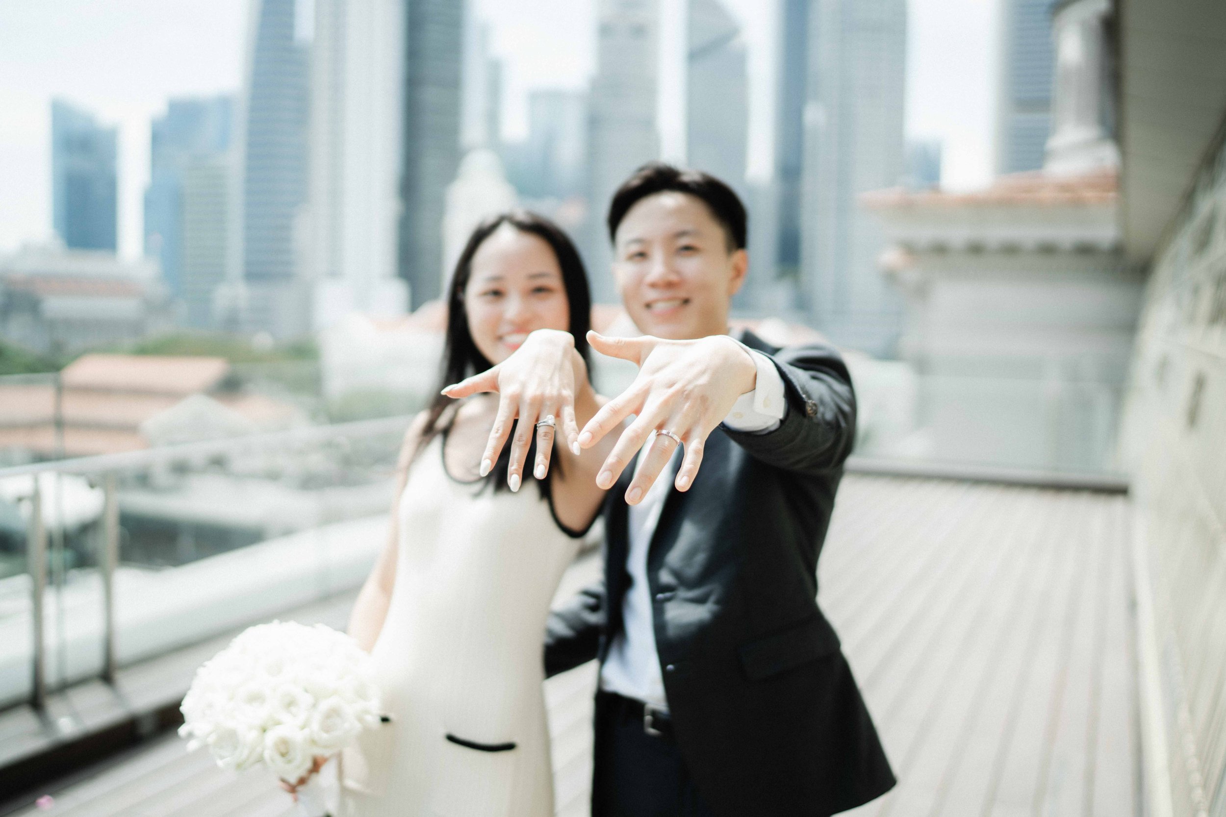 Bride and Groom Showing rings after ROM