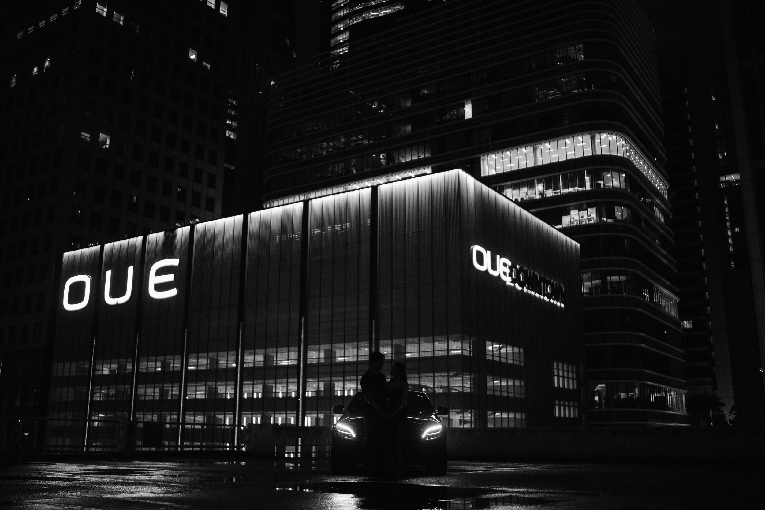 OUE Downtown car couple photo