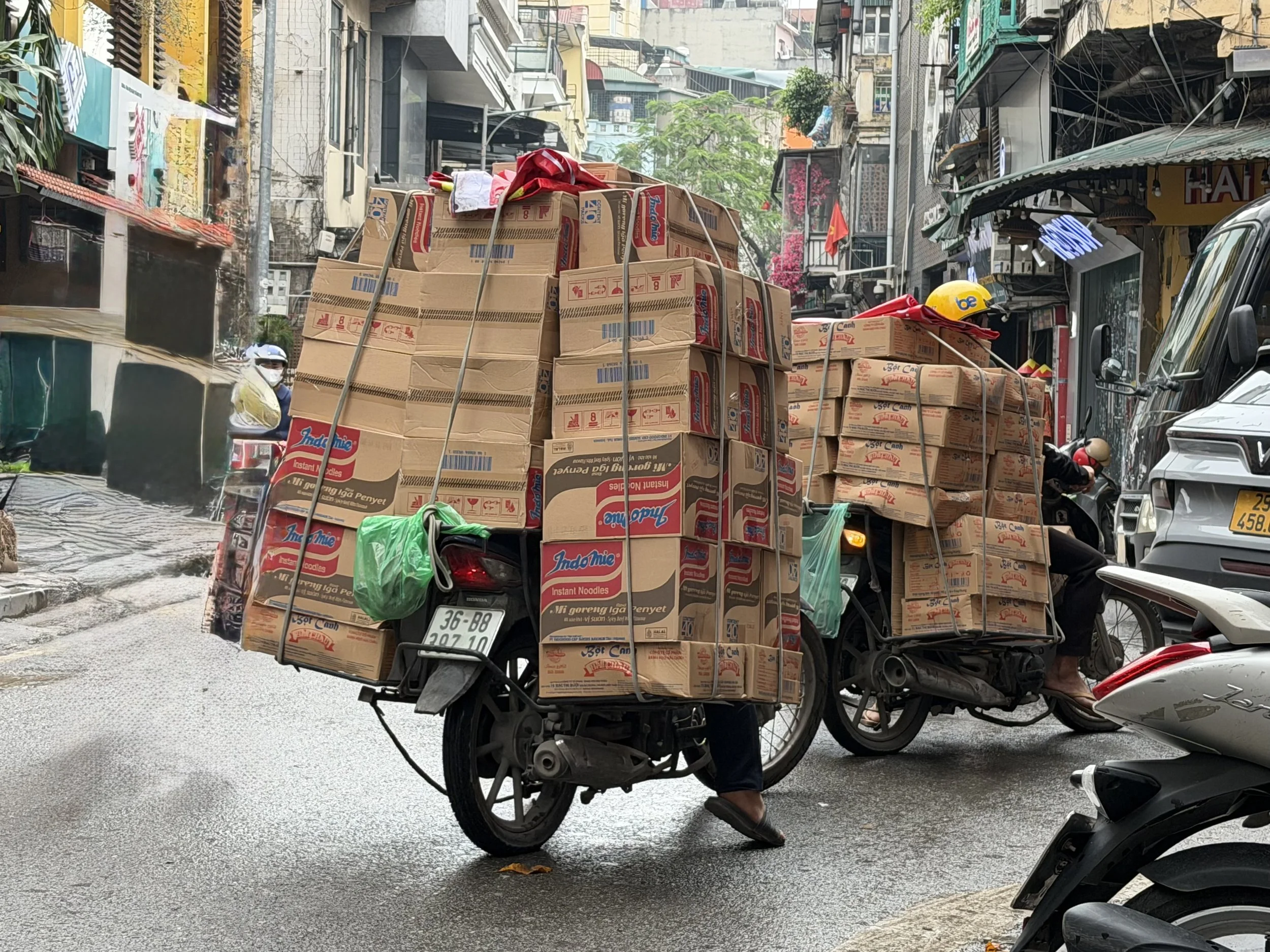 Motorcycles loaded with boxes.