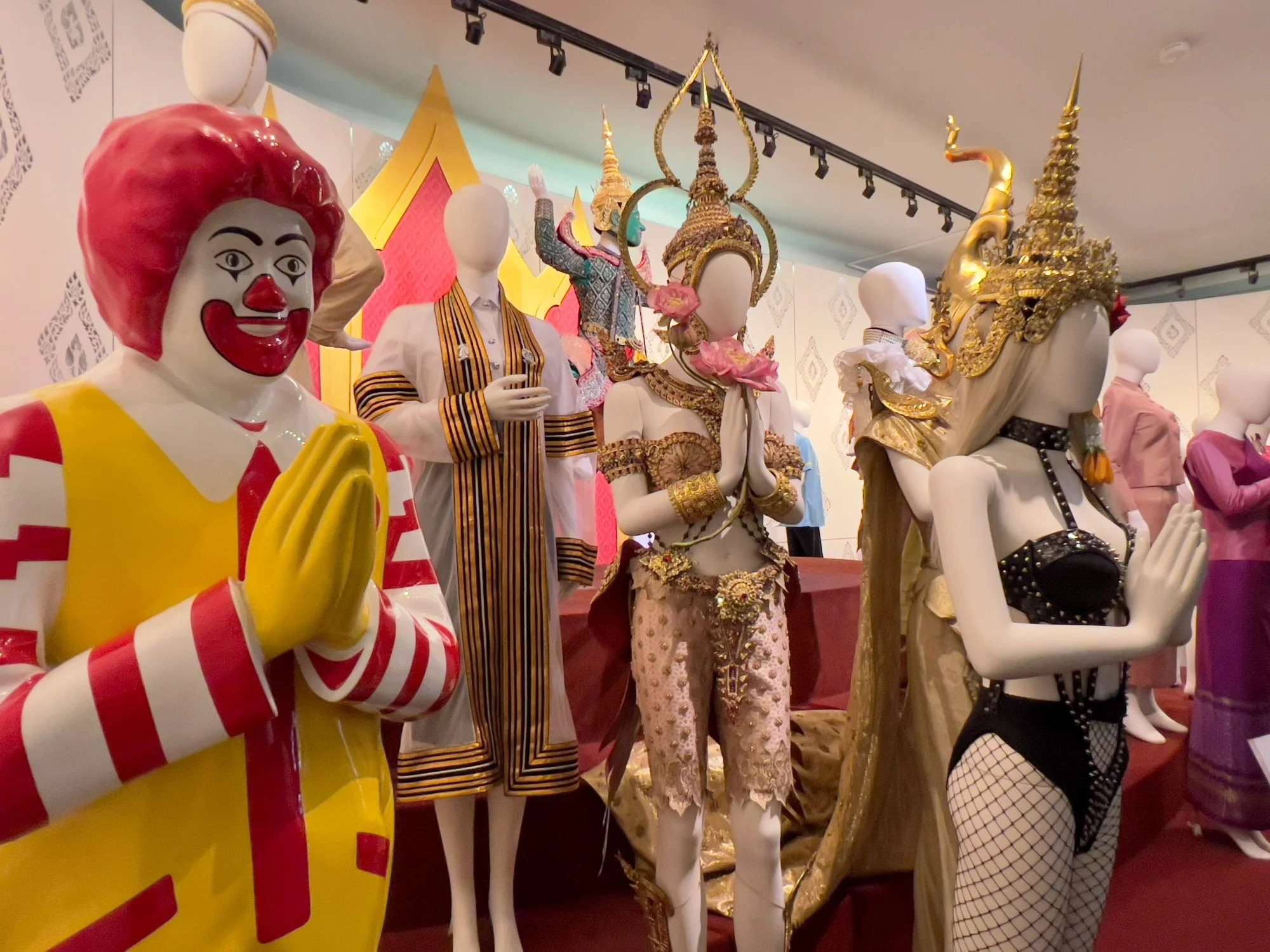Museum display showing Thai dress mixed and matched with that of other cultures.