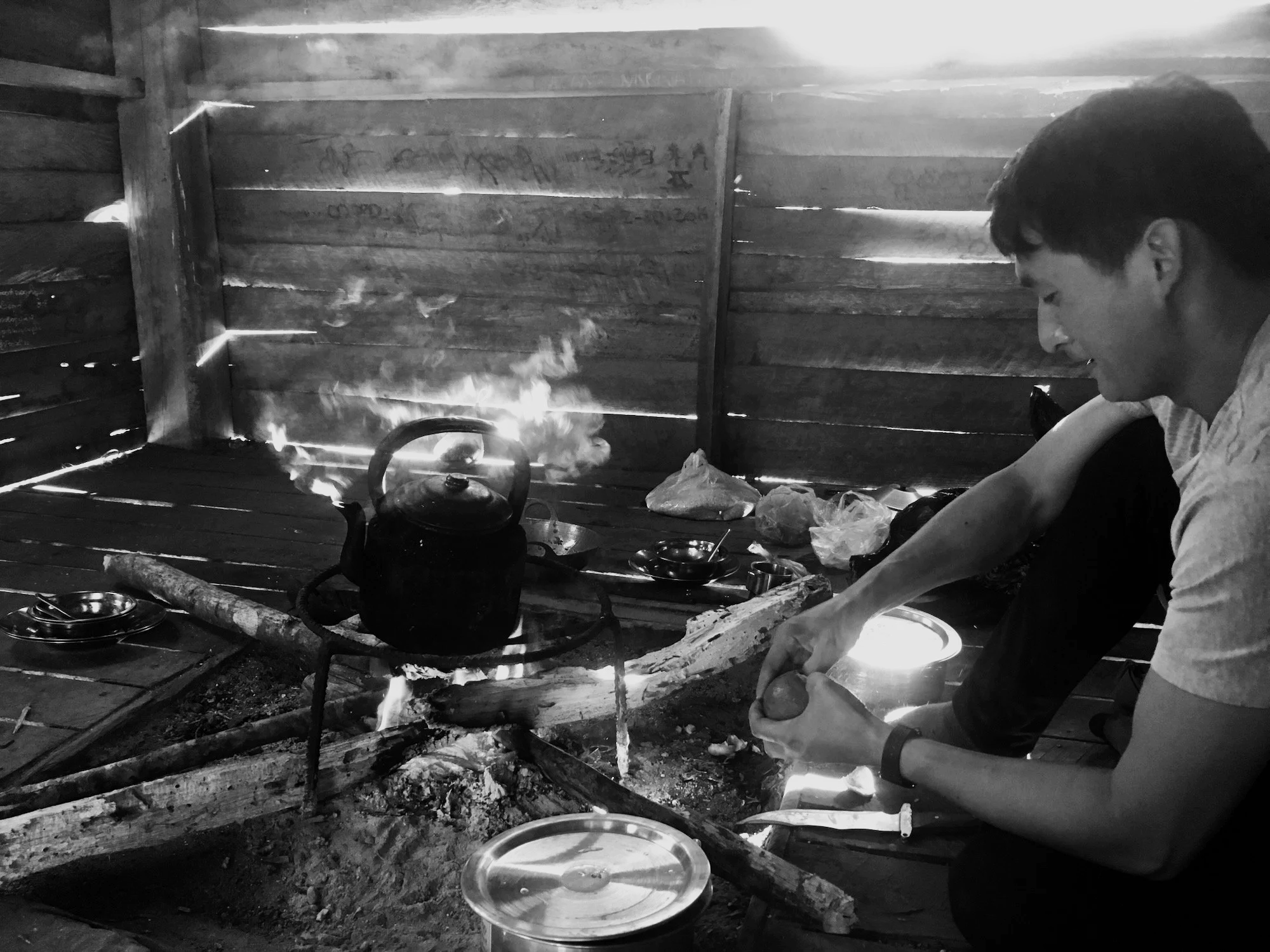 My guide, Aung, cooking over the campfire.