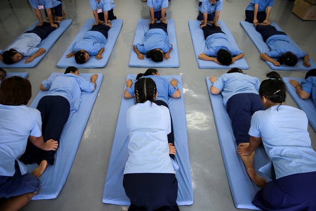 Inmates training in massage techniques.