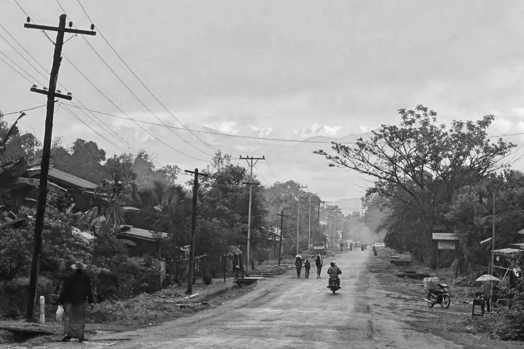 Putao's main street with the mountains in the distance.