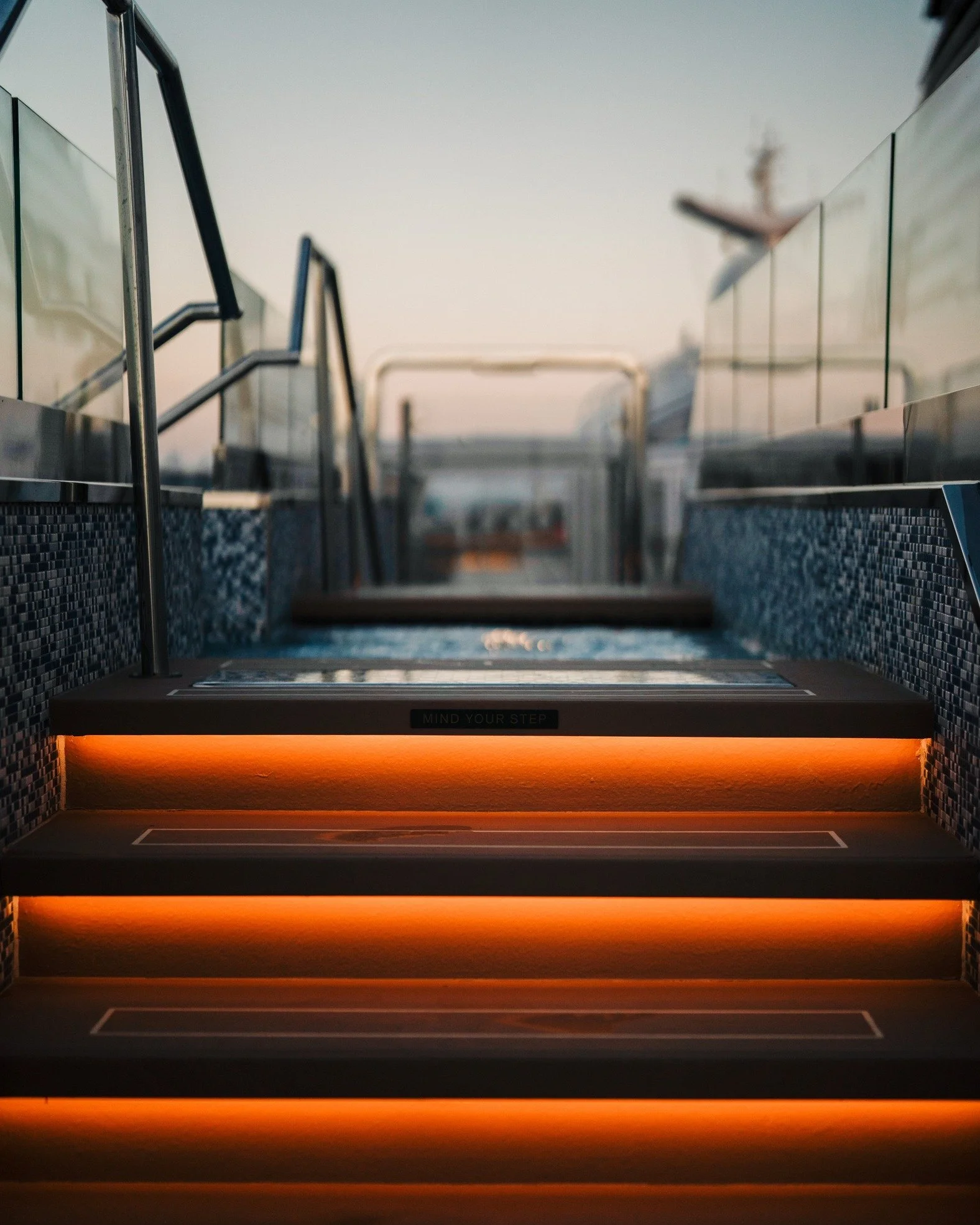 Stairs that feel more like sculpture.

These glowing steps lead to one of the many open-air jacuzzis aboard @explorajourneys &mdash; designed for soaking in the sea views and the stillness.

I&rsquo;m always drawn to symmetry, light play, and texture