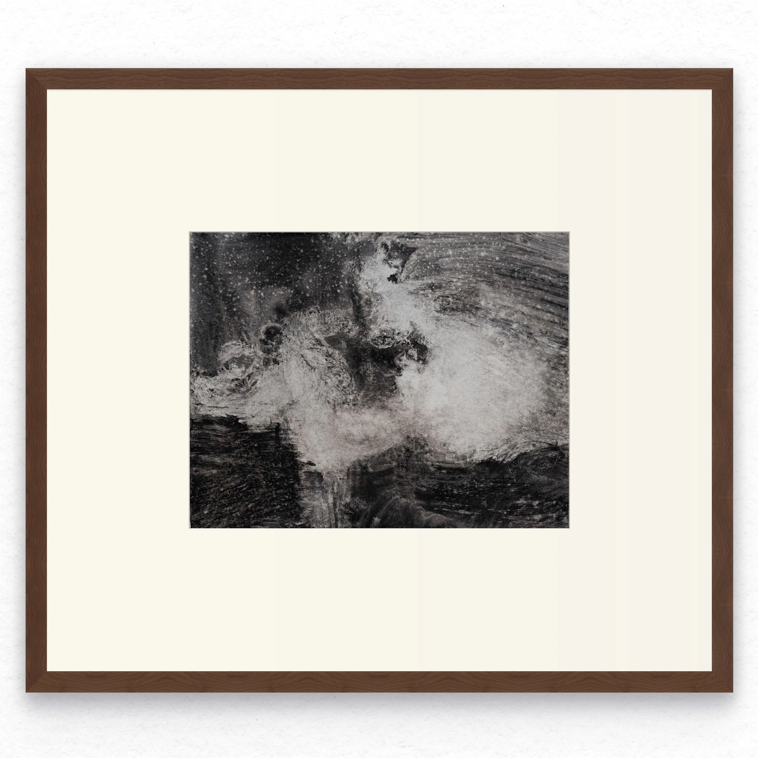 Shore 08 by Nicolas De Jesus — liquid charcoal and water on paper, waves crashing against rocks with a dramatic burst of white spray surging diagonally across dark rock and water, hardwood frame with mount