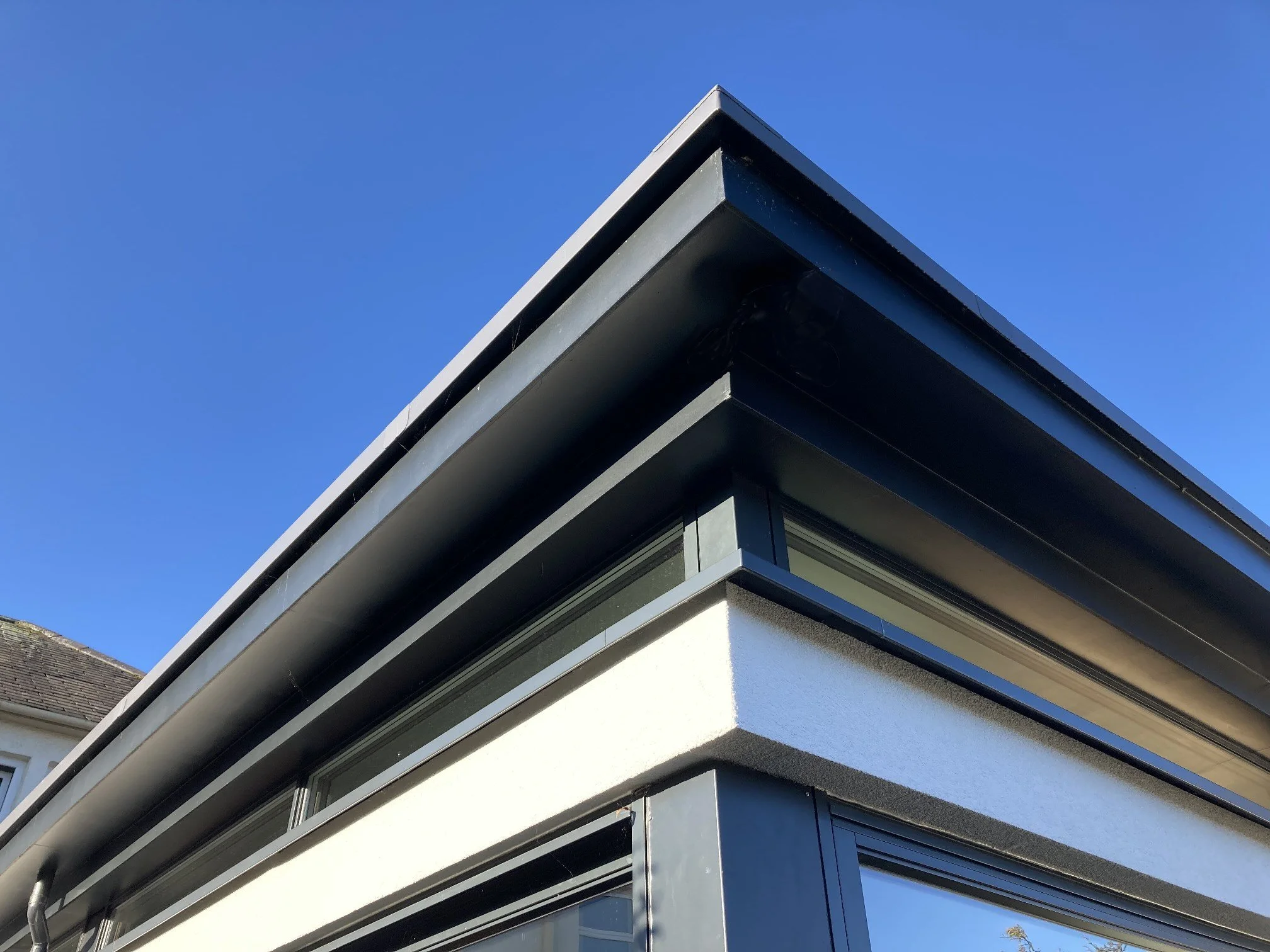 House extension corner of roof. Clerestorey glazing to brighten the space. Raising the roof on open plan living.