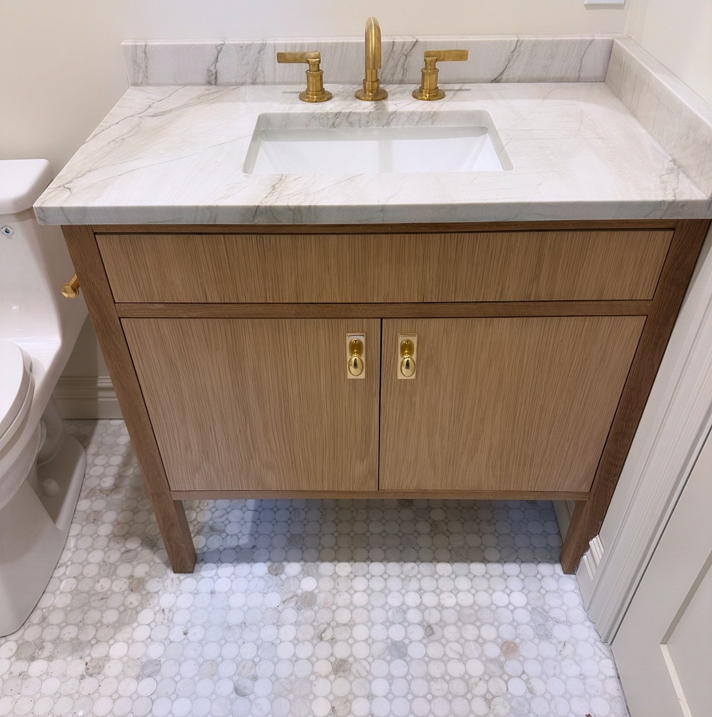 Loving this custom oak vanity we made for a recent project. #rejuvenationhardware #kohler #oakvanity #marblemosaic #bostonremodeling
