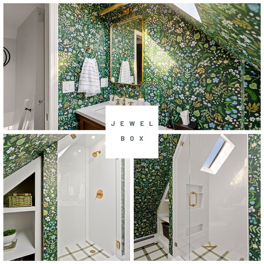 Our clients had an extremely cramped bathroom with a corner fiberglass shower. They craved functionality so we redesigned the space with a pocket door to enter and a larger glass enclosed shower. The homeowner chose an adorable wallpaper and library 