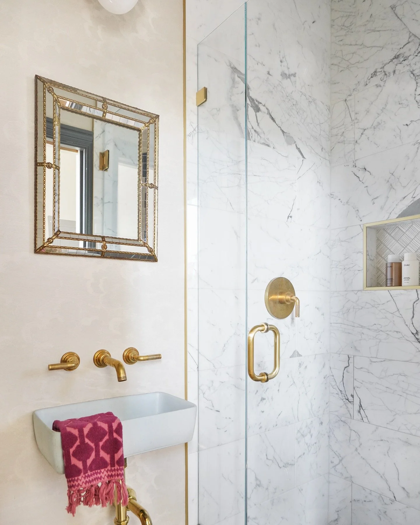 This small but mighty full bath occupies an approximately 3x8 space along a hallway. Access is made possible through a pocket door and space saved through a wall hung concrete sink from @concretti_designs. #tinyfullbath #bathroomsofinstagram #concret