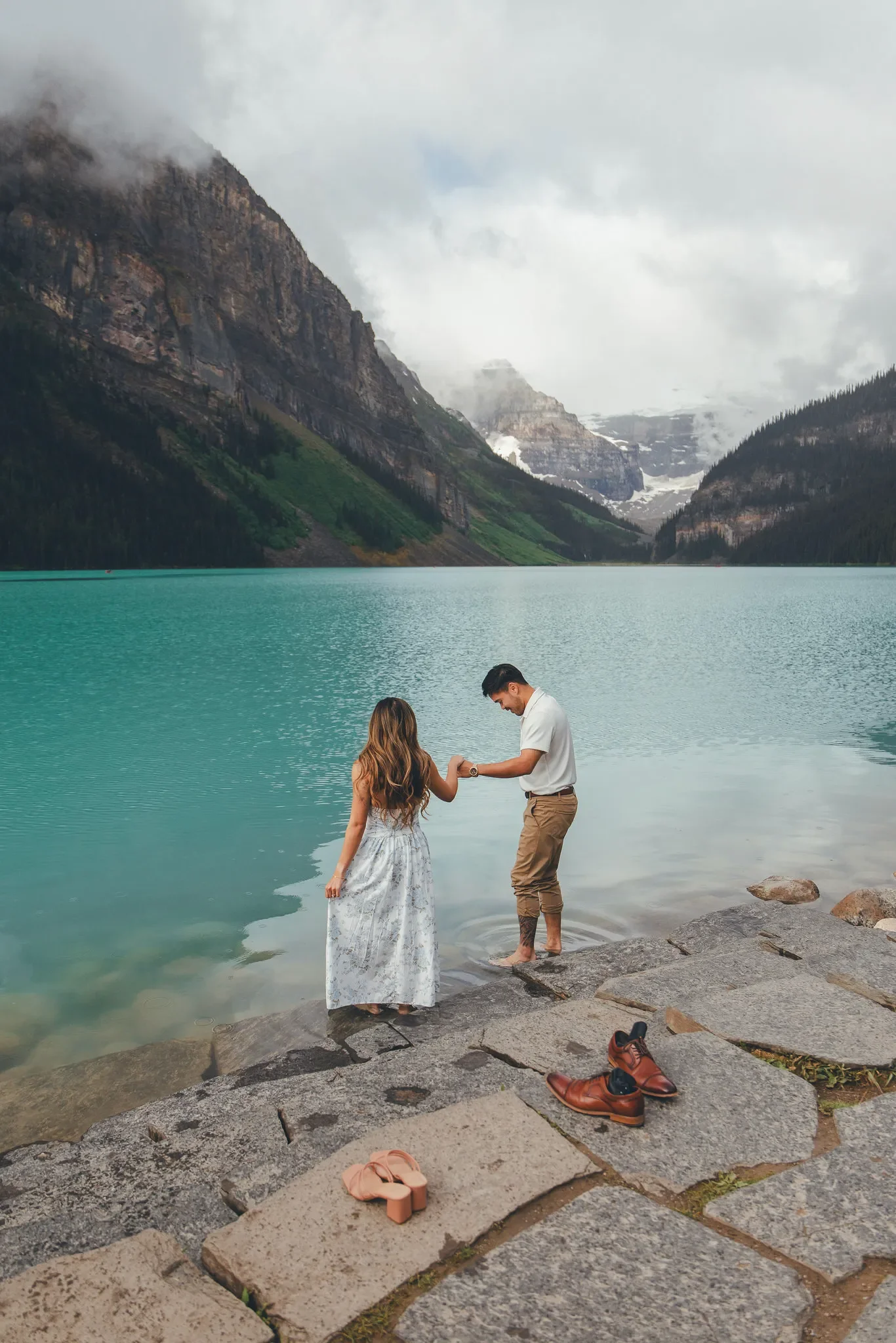 165_Couple-Holding-Hands-Lake-Louise-Banff.webp