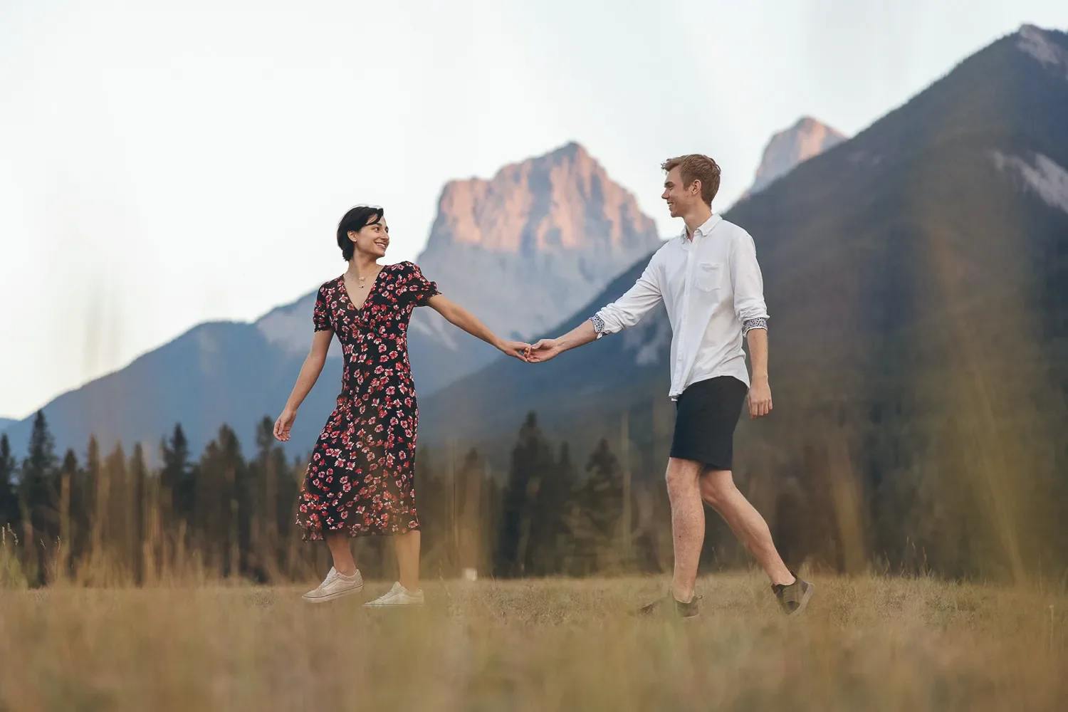 111_Couple-Walking-Mountain-Landscape-Banff-Canadian-Rockies-Golden-Hour.webp