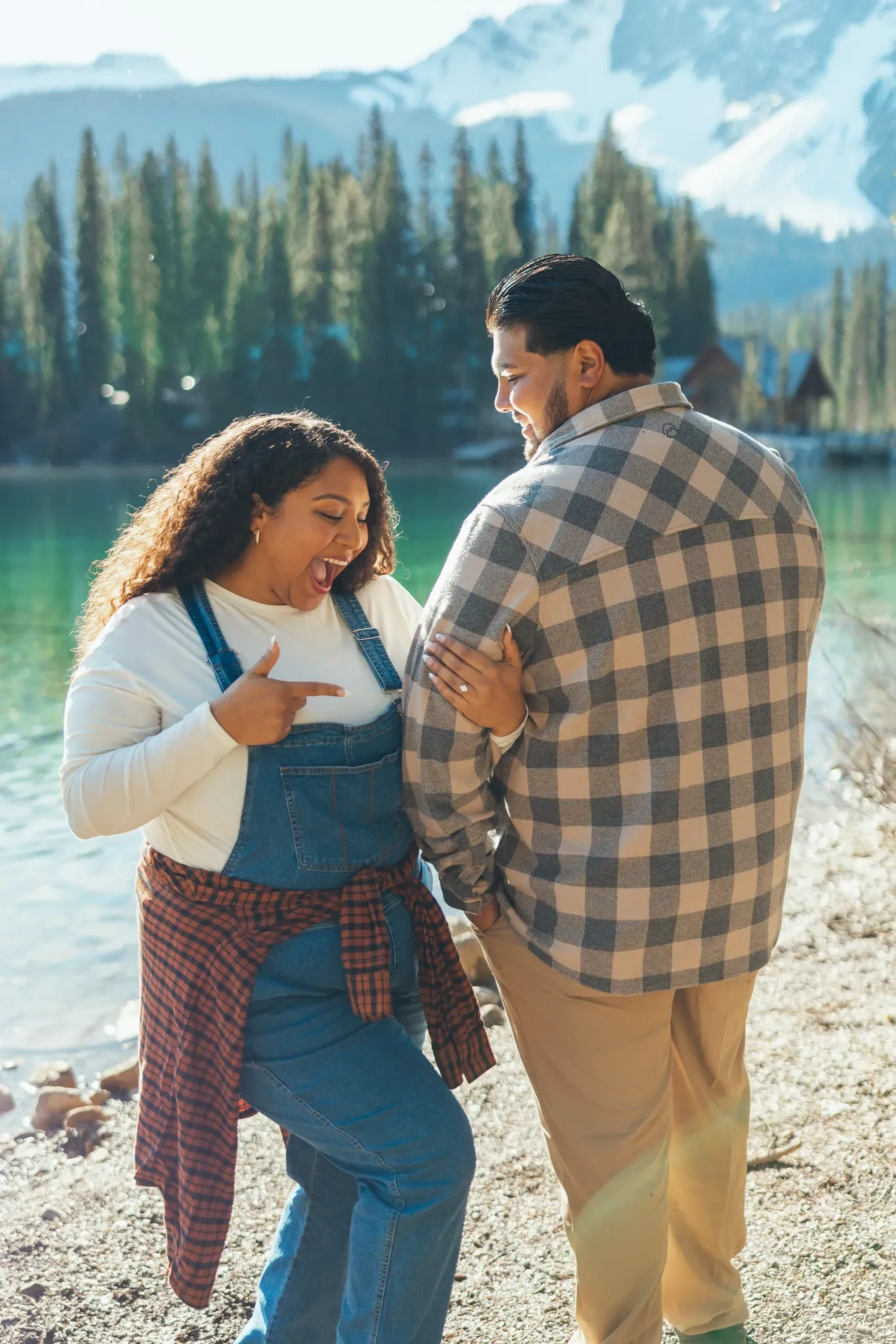 146_Couple-Engagement-Showing-Ring-Mountain-Lake-Canadian-Rockies.webp