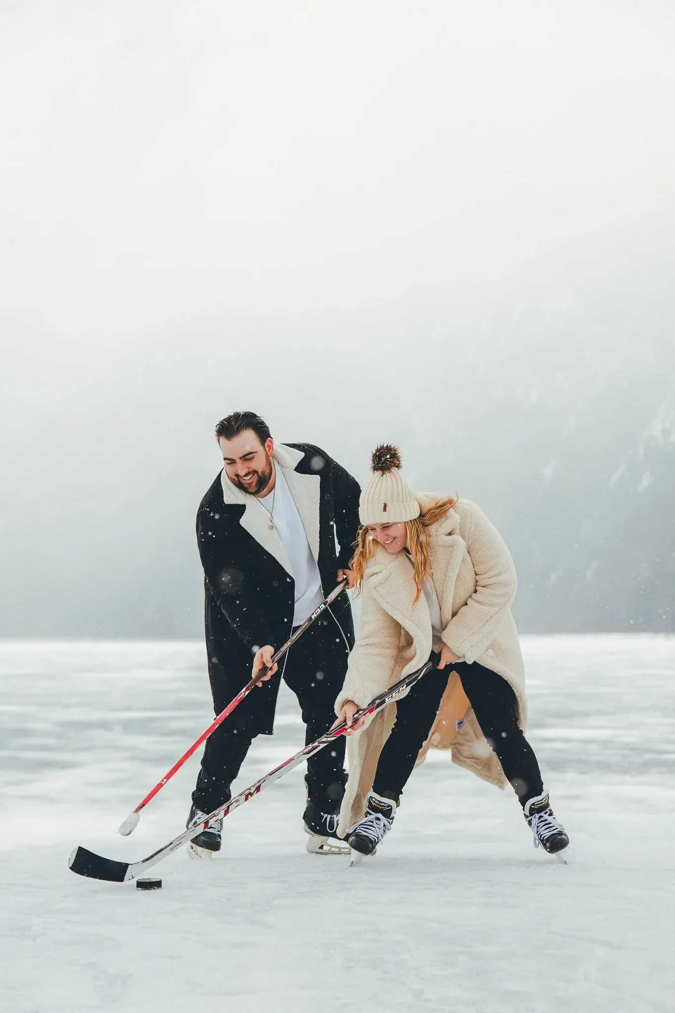 126_Couple-Playing-Hockey-Frozen-Alpine-Lake-Canadian-Rockies.webp