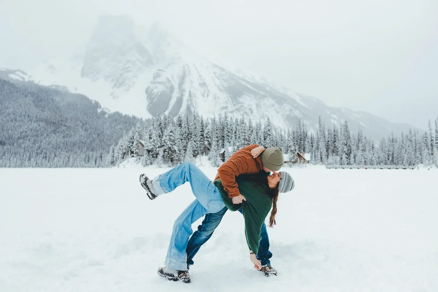 122_couple-dipping-on-frozen-emerald-lake-canadian-rockies.webp