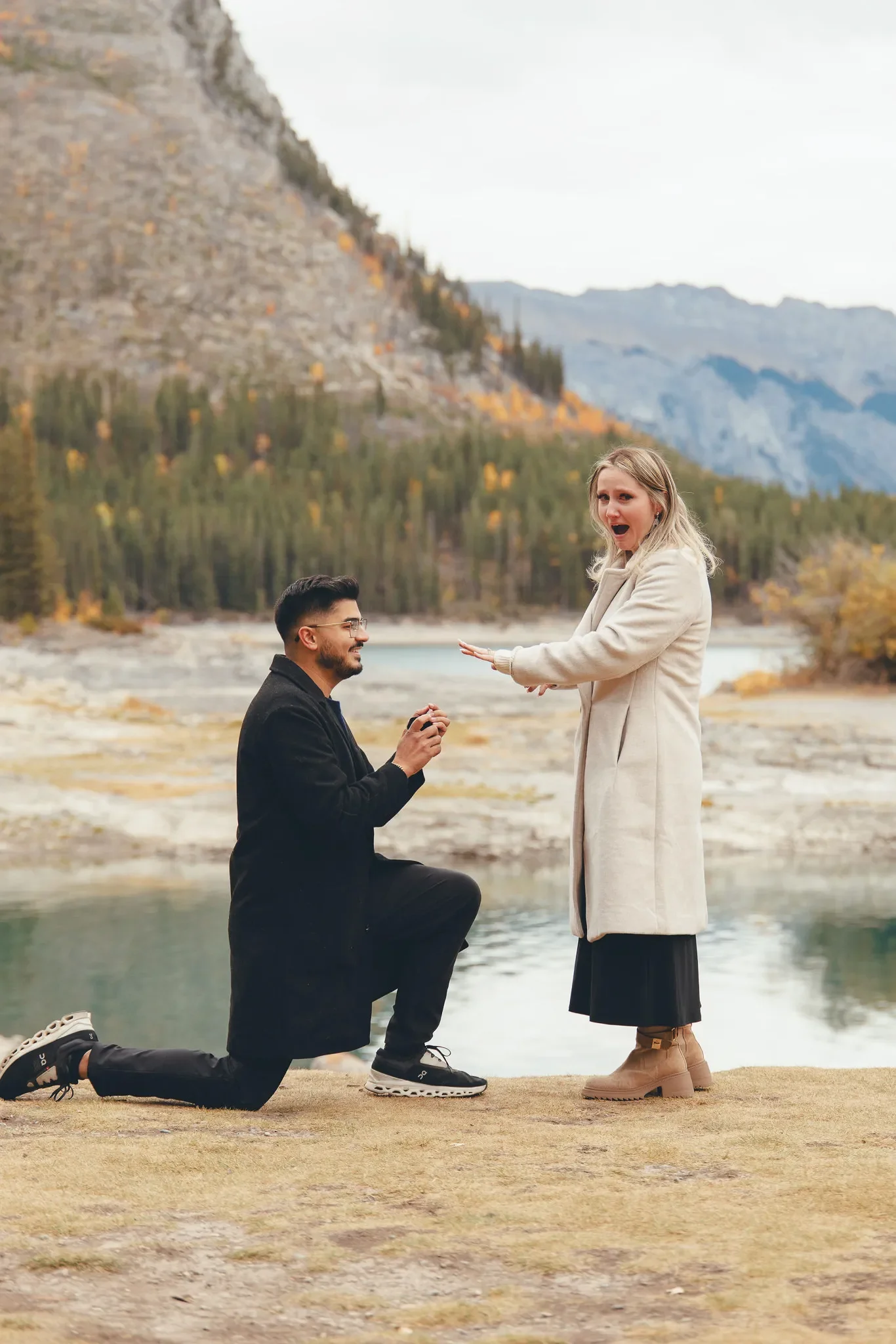 145_Surprise-Proposal-Couple-Mountain-Lake-Canadian-Rockies.webp