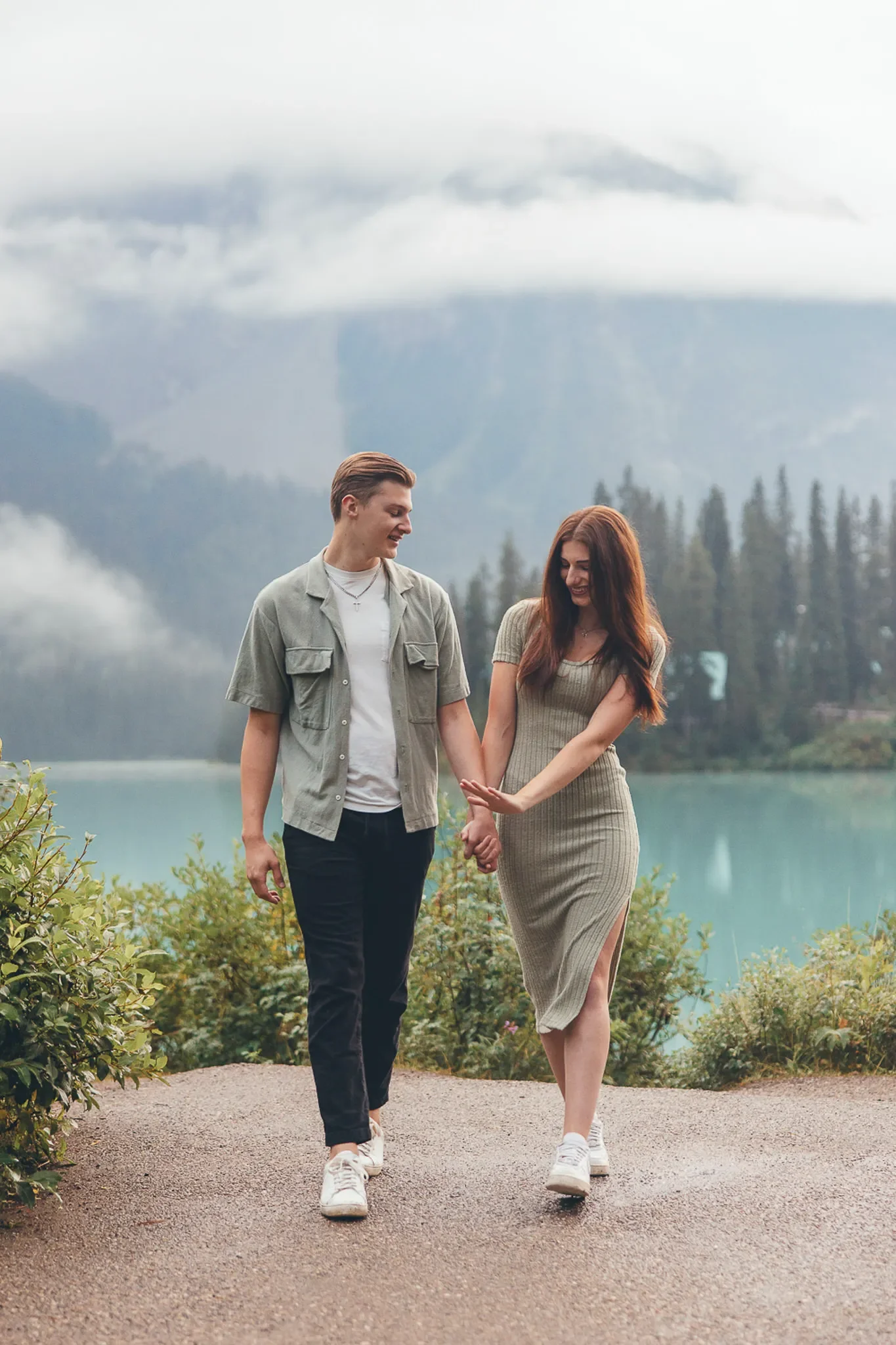 158_Engagement-Couple-Walking-Alpine-Lake-Canadian-Rockies.webp