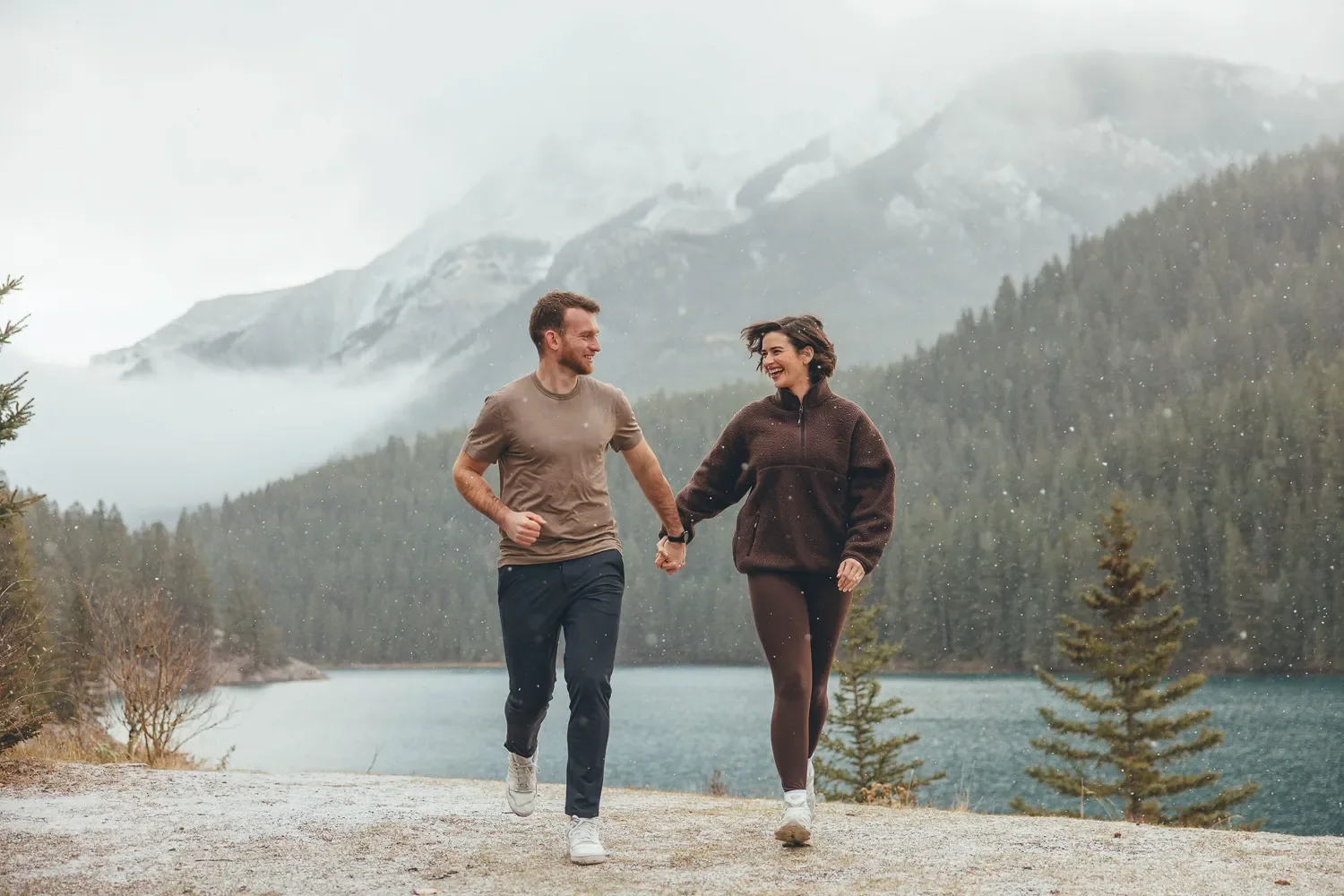 106_Couple-Walking-Holding-Hands-Canadian-Rockies-Mountain-Lake.webp