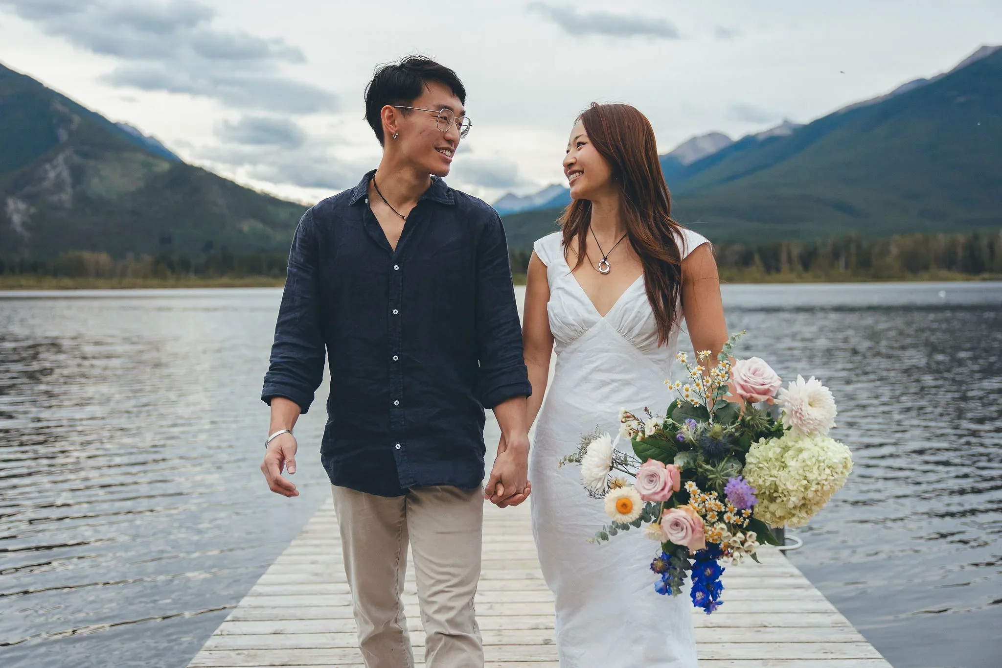122_Couple-Walking-Dock-Alpine-Lake-Canadian-Rockies.webp