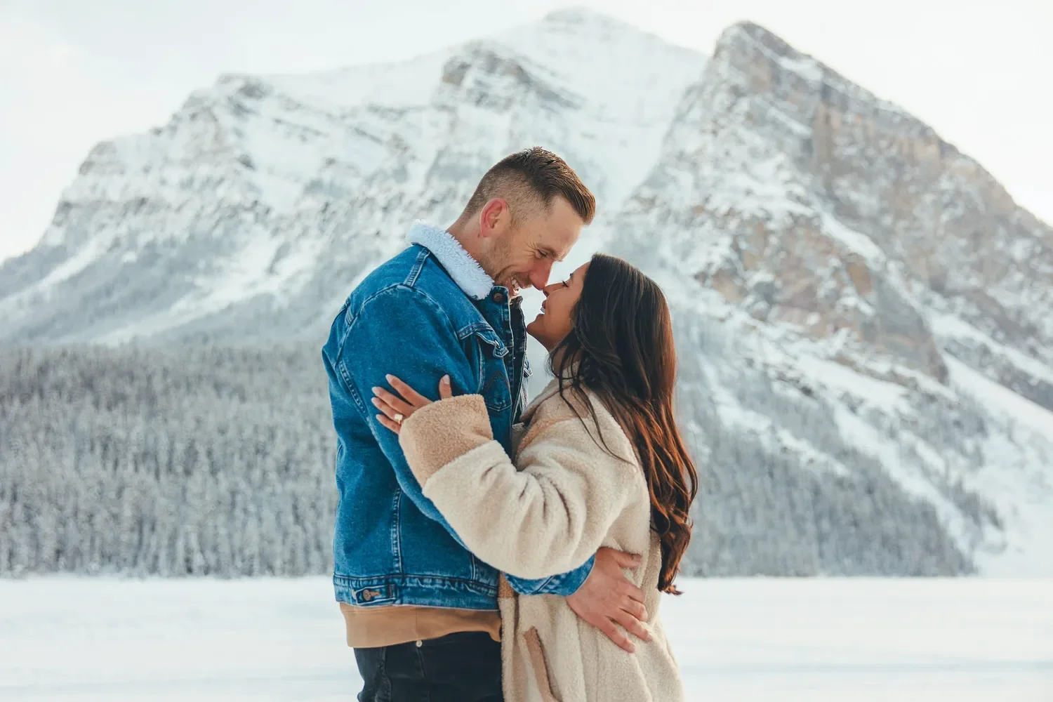 107_couple-engagement-canadian-rockies-snowy-mountain.webp