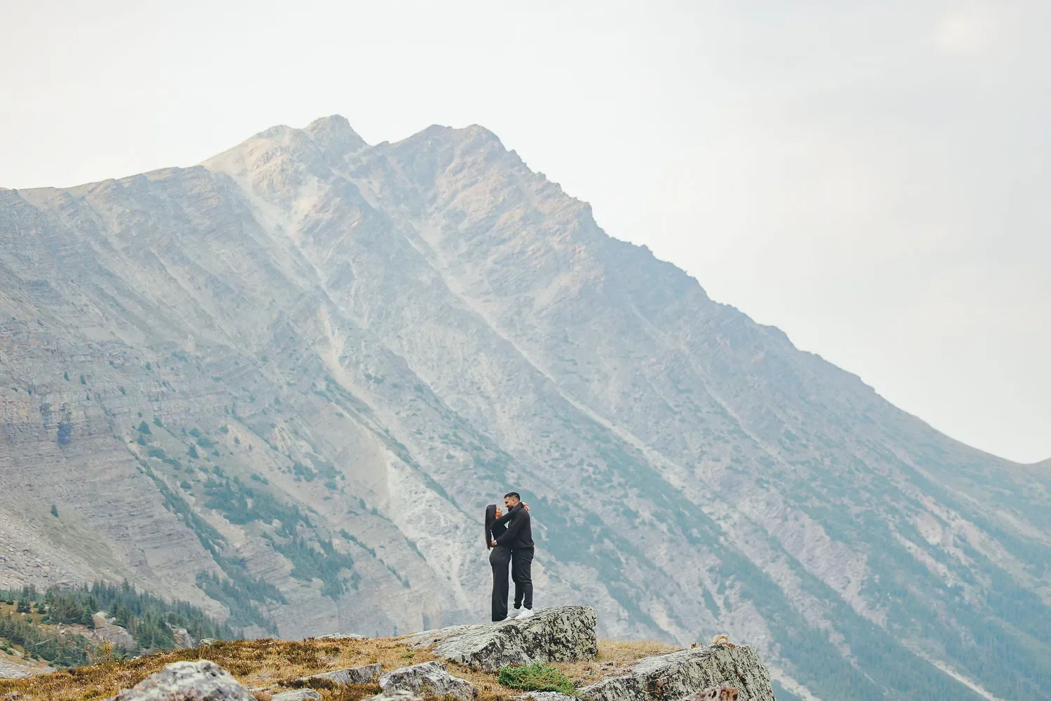 106_Couple-Embracing-Mountain-Landscape-Canadian-Rockies.webp