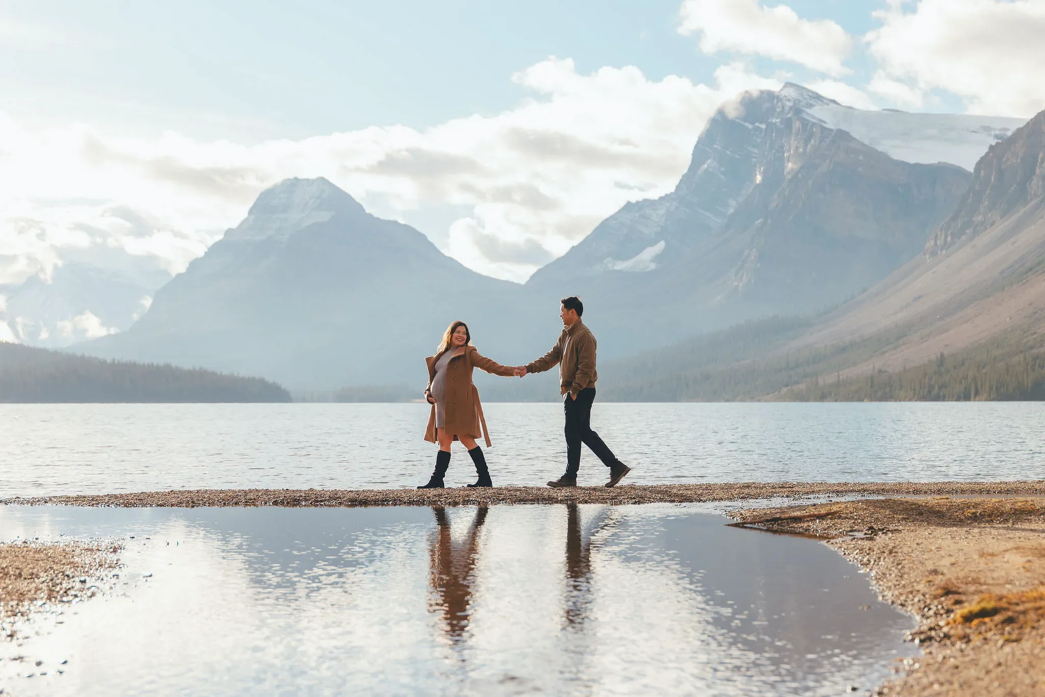 136_maternity-couple-walking-alpine-lake-canadian-rockies.webp