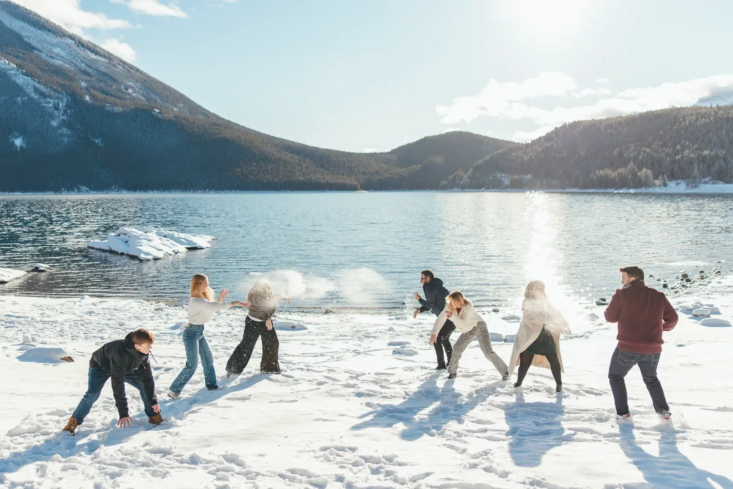 119_group-throwing-snow-alpine-lake-canadian-rockies.webp