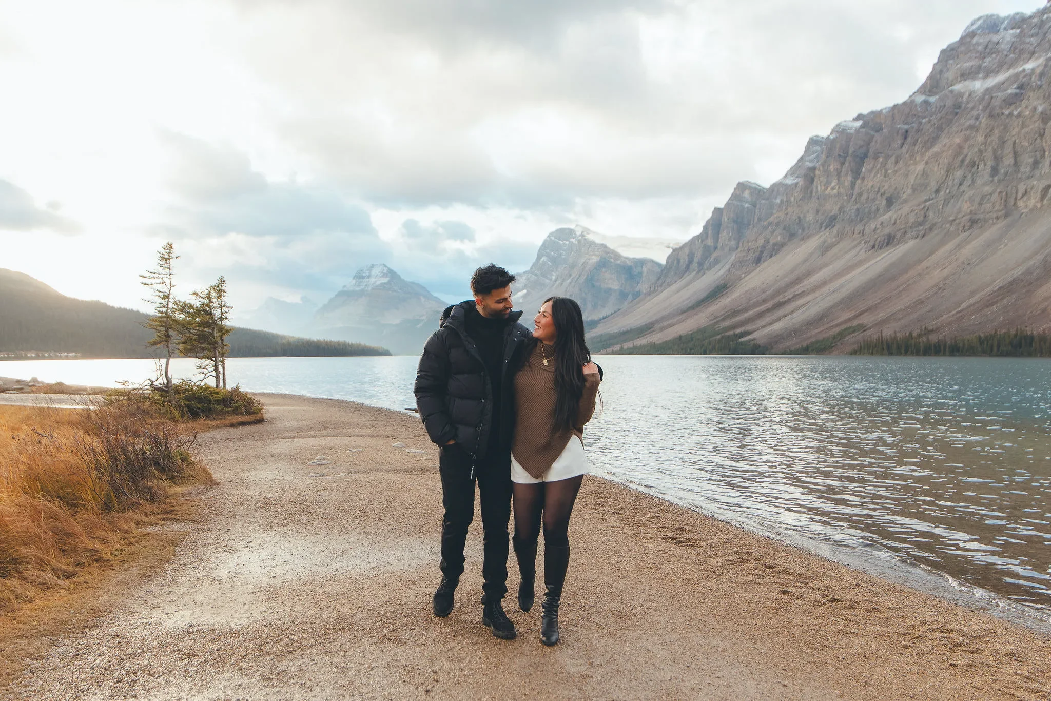 111_Couple-Walking-Shoreline-Alpine-Lake-Canadian-Rockies.webp