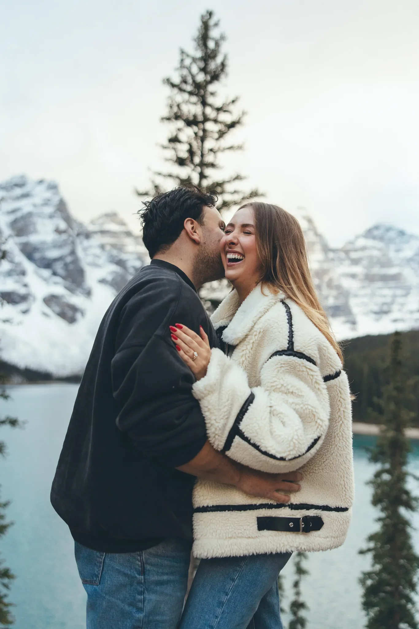 140_laughing-couple-engagement-moraine-lake-banff.webp