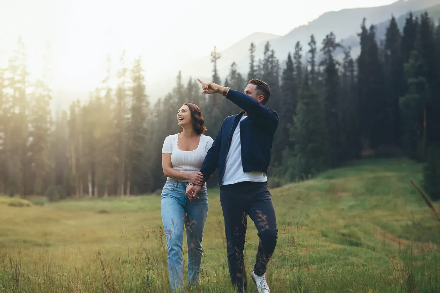 115_couple-walking-mountain-meadow-golden-hour.webp