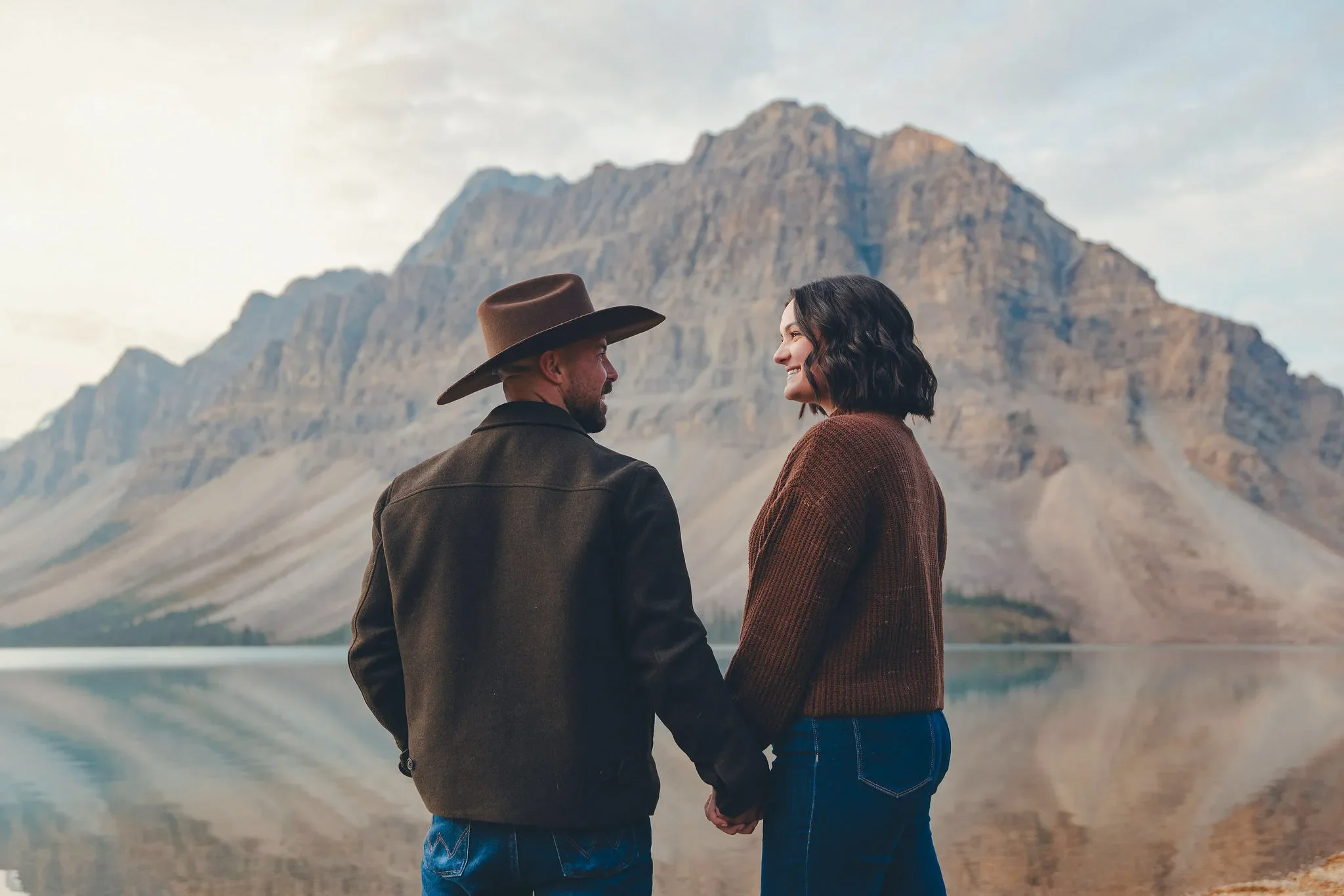125_Couple-Holding-Hands-Mountain-Lake-Banff.webp