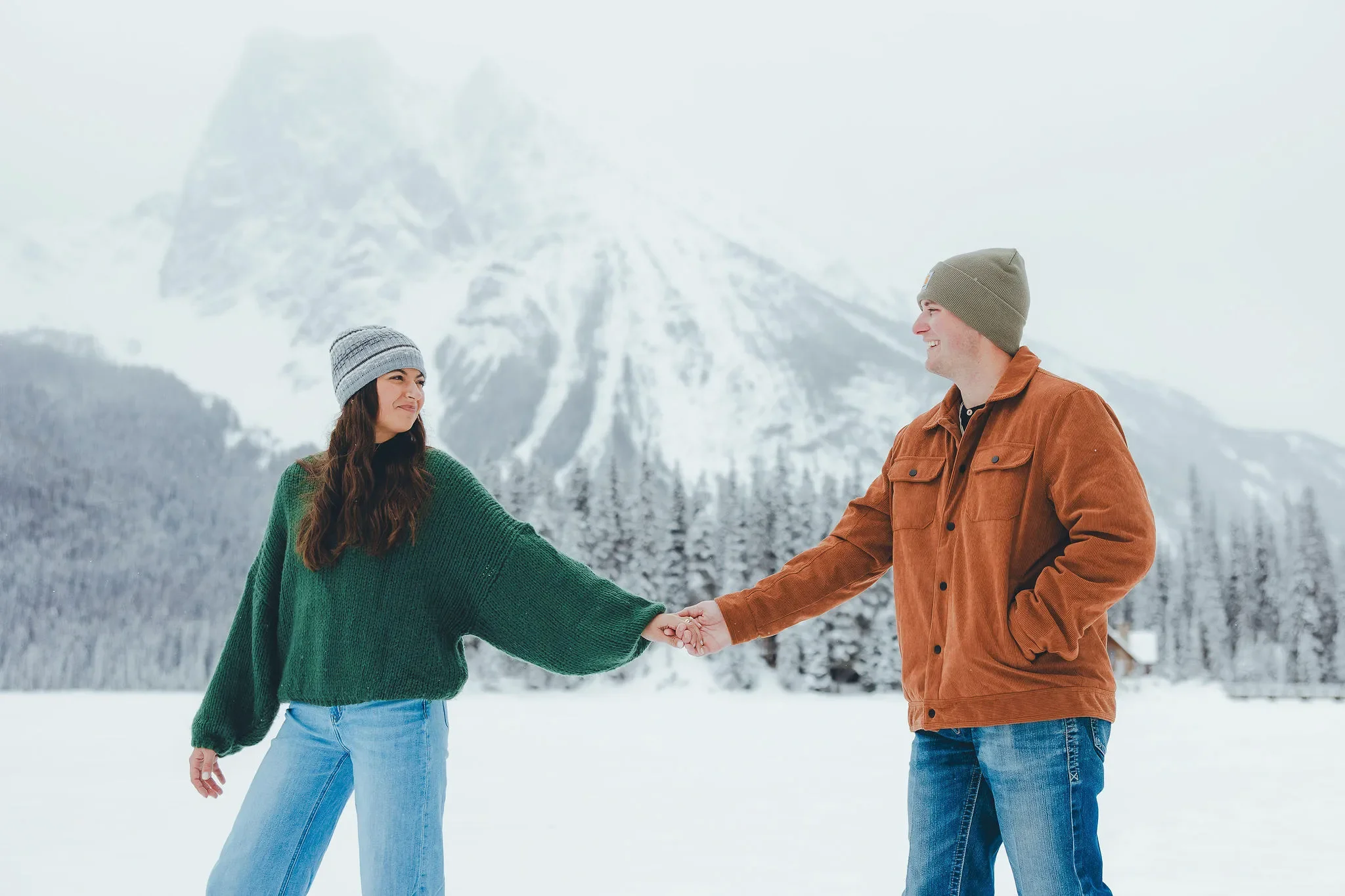 120_Couple-Holding-Hands-Snowy-Mountain-Landscape-Canadian-Rockies.webp