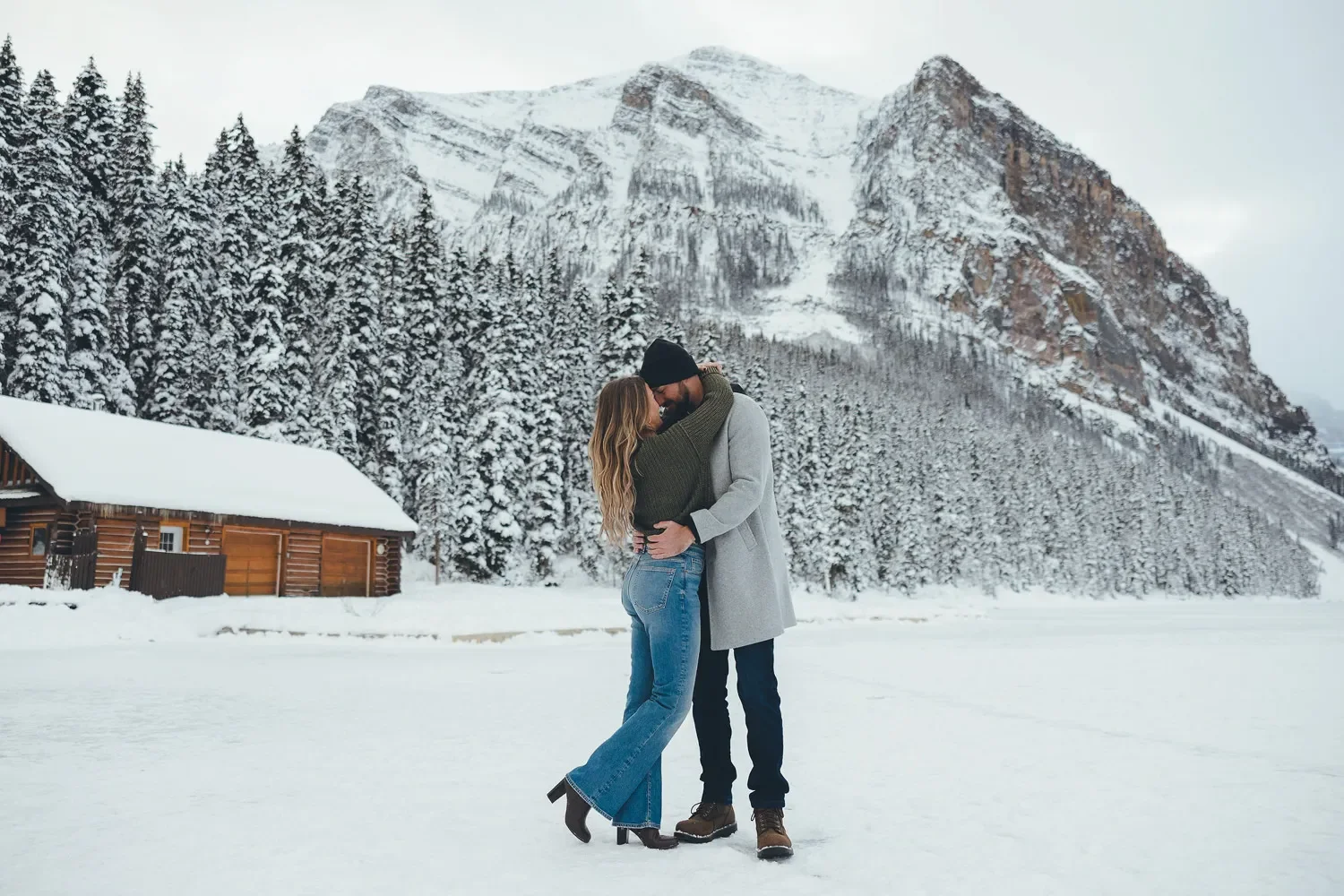 121_Couple-Embracing-Winter-Mountain-Landscape-Lake-Louise.webp