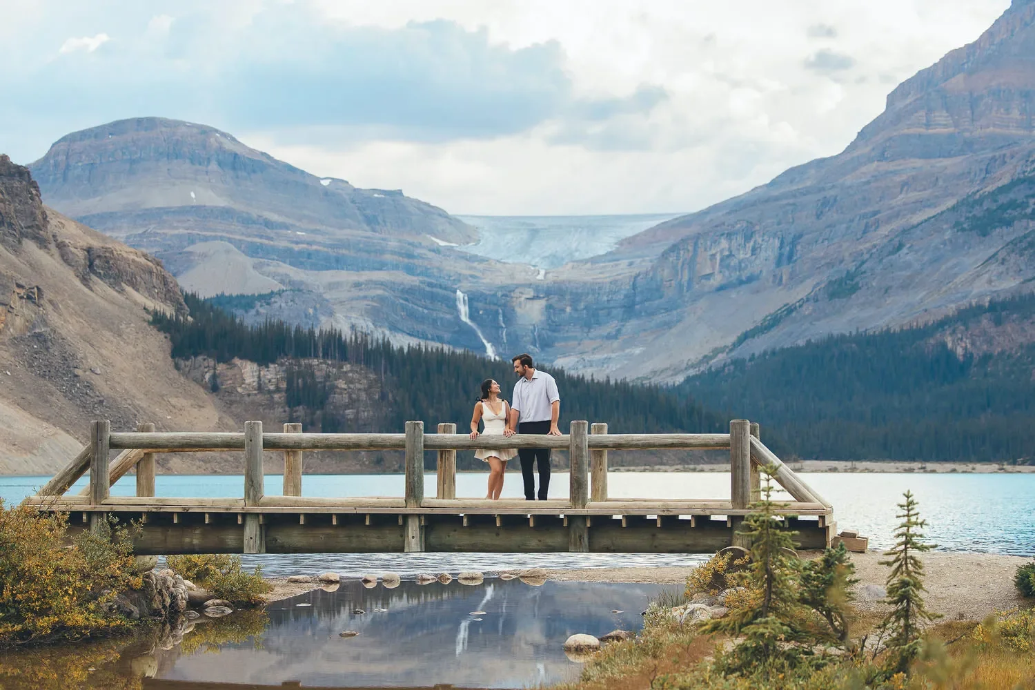 110_Couple-Standing-On-Wooden-Bridge-At-Alpine-Lake-Banff.webp