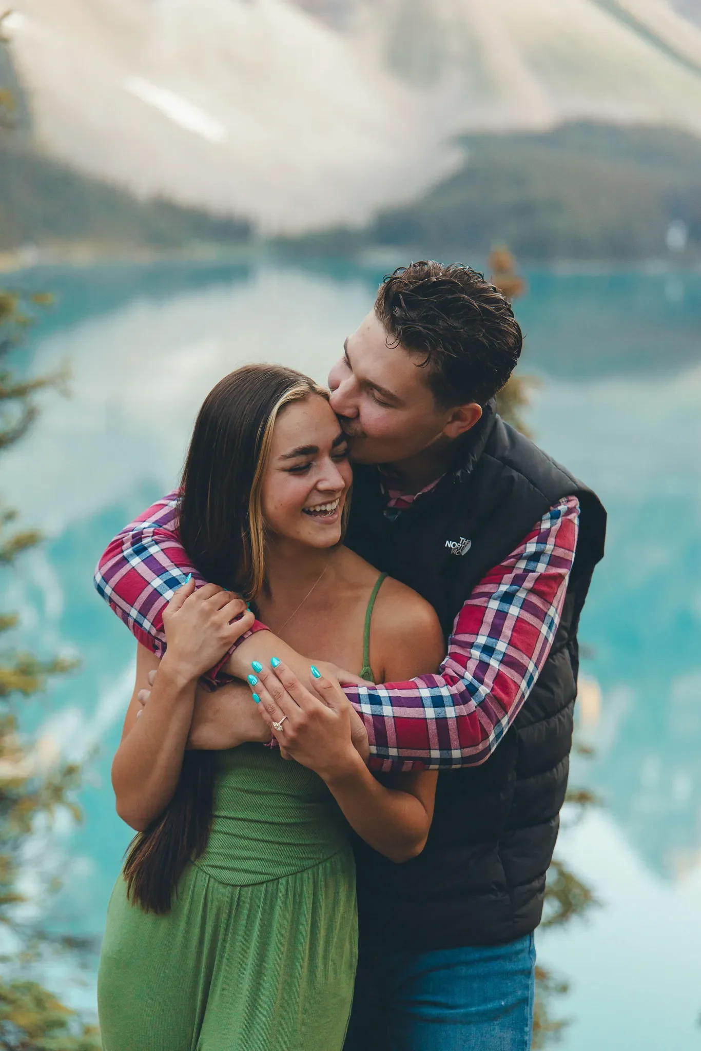156_couple-engagement-canadian-rockies-alpine-lake.webp