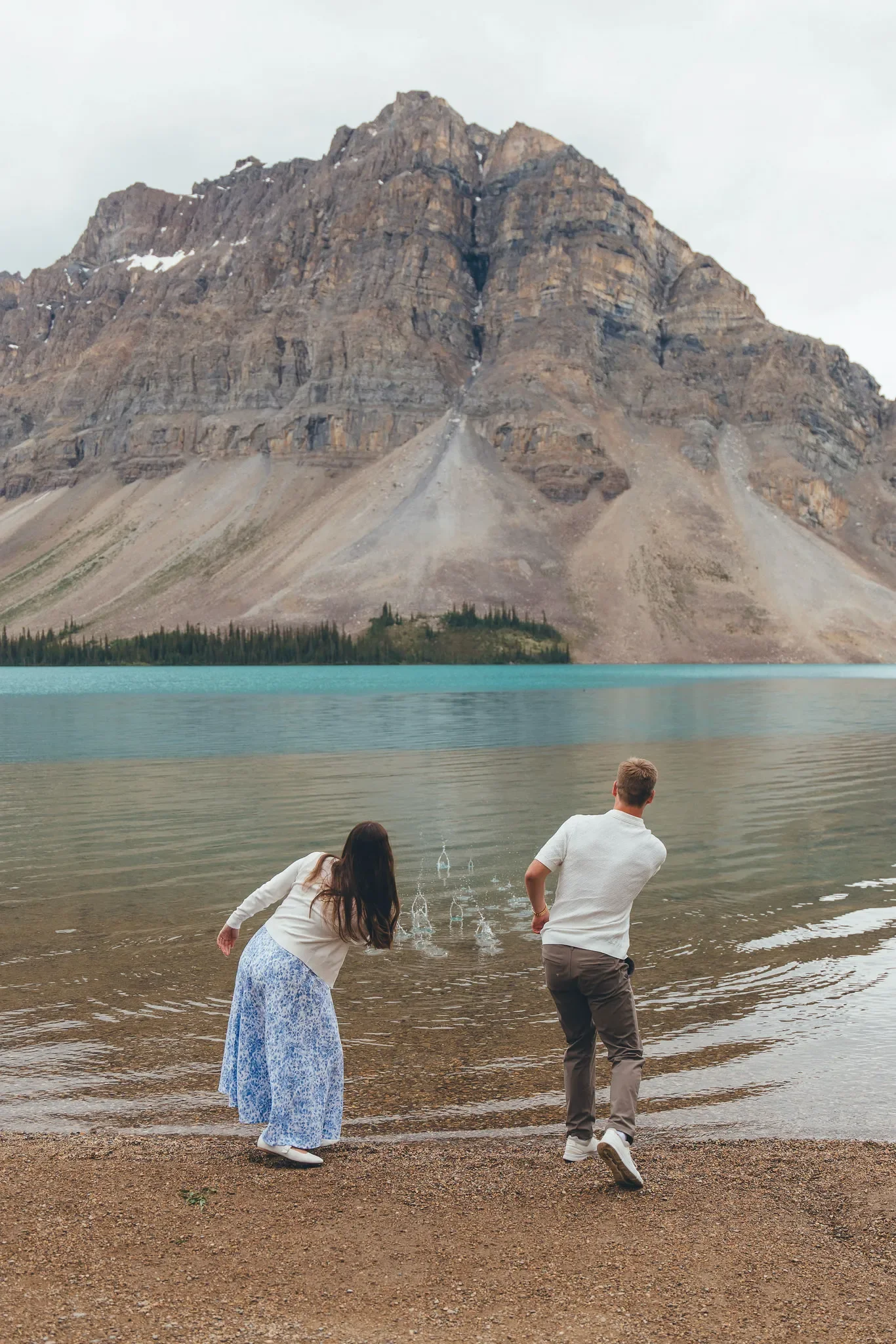 136_Couple-Skipping-Stones-Alpine-Lake-Canadian-Rockies.webp