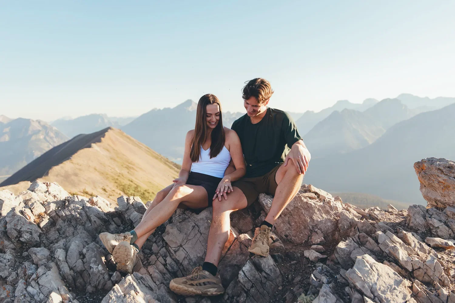 102_Couple-Hiking-Engagement-Mountain-Viewpoint-Canadian-Rockies-Golden-Hour.webp