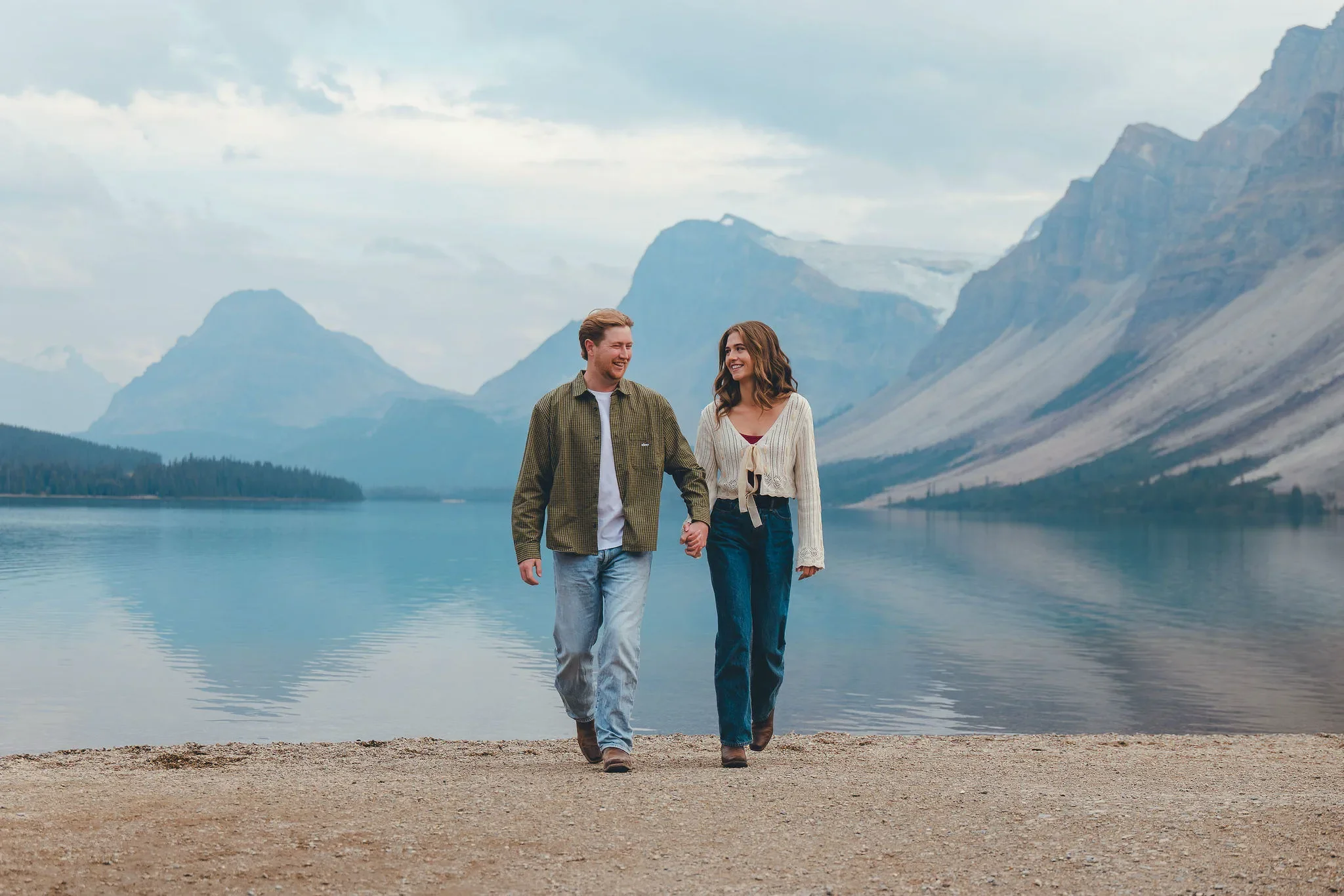 162_Couple-Walking-Hand-In-Hand-Alpine-Lake-Canadian-Rockies.webp