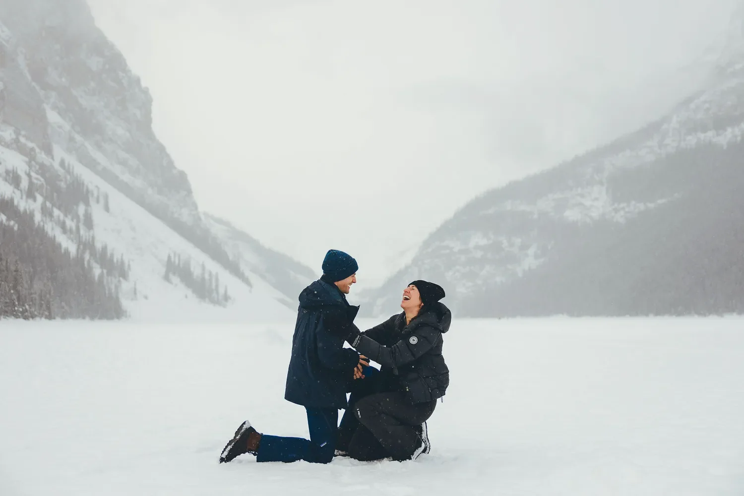 119_couple-proposal-lake-louise-winter-canadian-rockies.webp